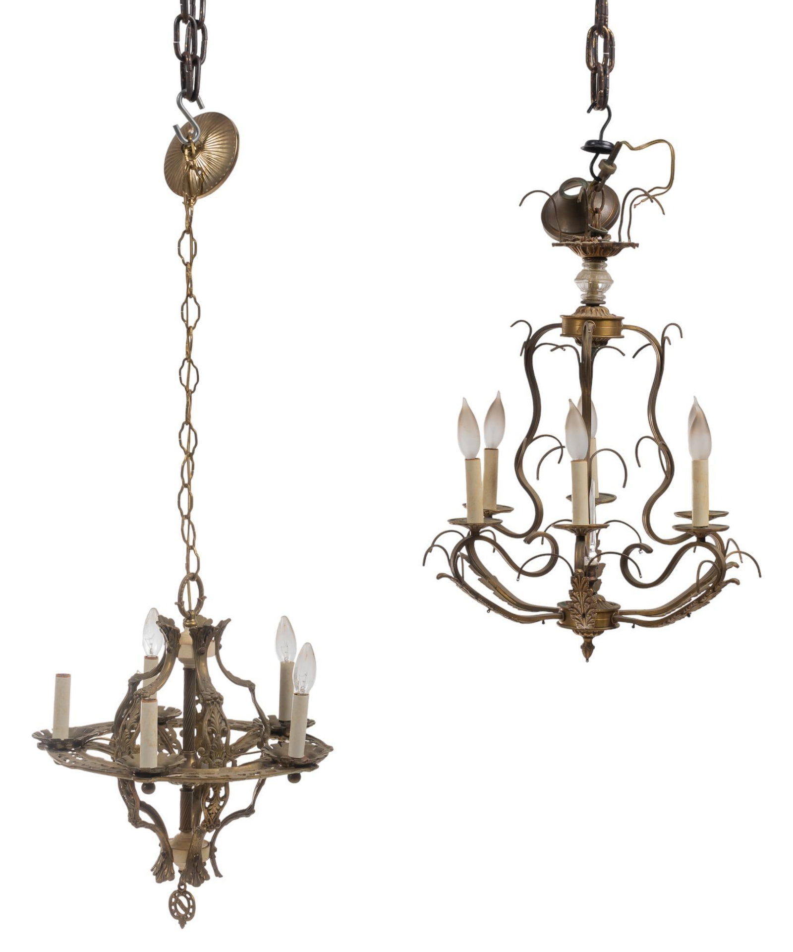 (2) Metal Chandeliers: Two (2) unmatched metal chandeliers, differing designs, both culminating in faux candles We happily provide seamless shipping services on everything we sell. Please email us at shipping@vogtauctio