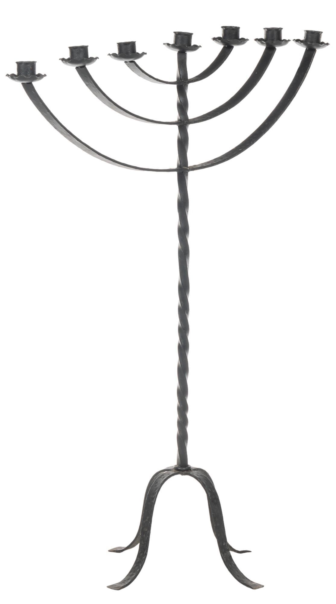 Wrought Iron Candelabra: Wrought iron candelabra, with ribbon base, supporting six candles height 48.25 in. x width 38 in. x depth 18 in. We happily provide seamless shipping services on ever