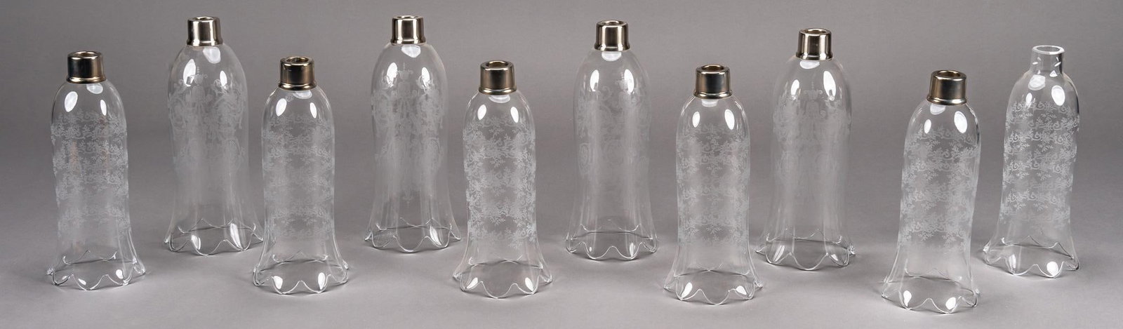 (10) Chandelier Glass Shades: Ten (10) chandelier glass shades, cut glass shades possibly part of a chandelier, brass collar on each towards the bottom, length 11 in. x width 5 in. We happily provide seamless shipping services on 