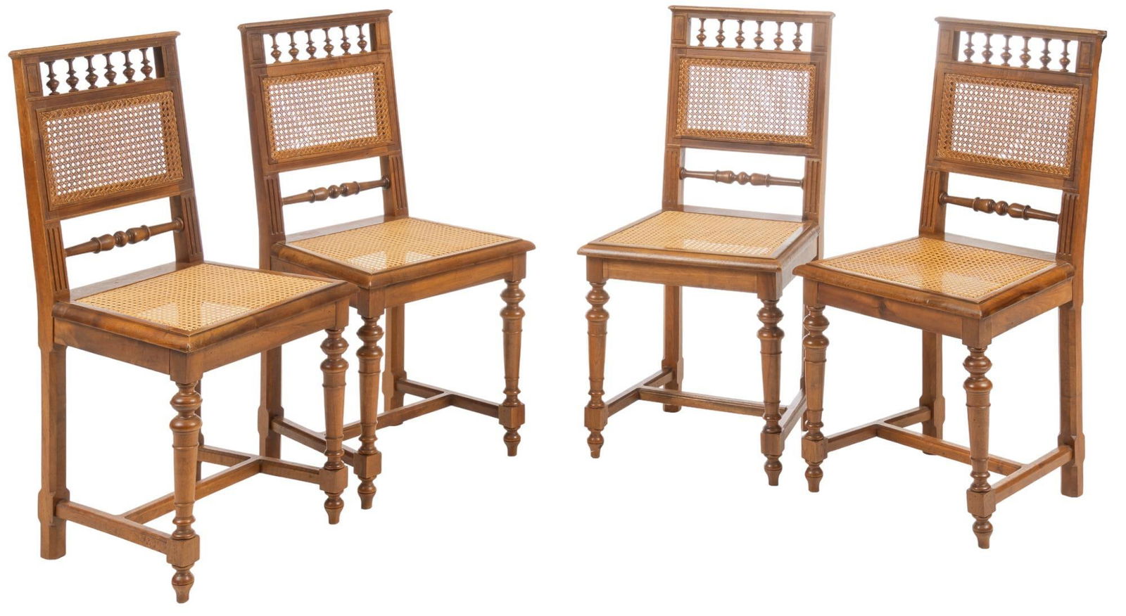 Set of (4) Cane-Work Chairs: Set of four cane-work chairs, with square backs, featuring turned balustrade accents, above caned backs and seats, supported on fluted legs height 36.25 in. x width 17.75 in. x depth 16 in. / each W