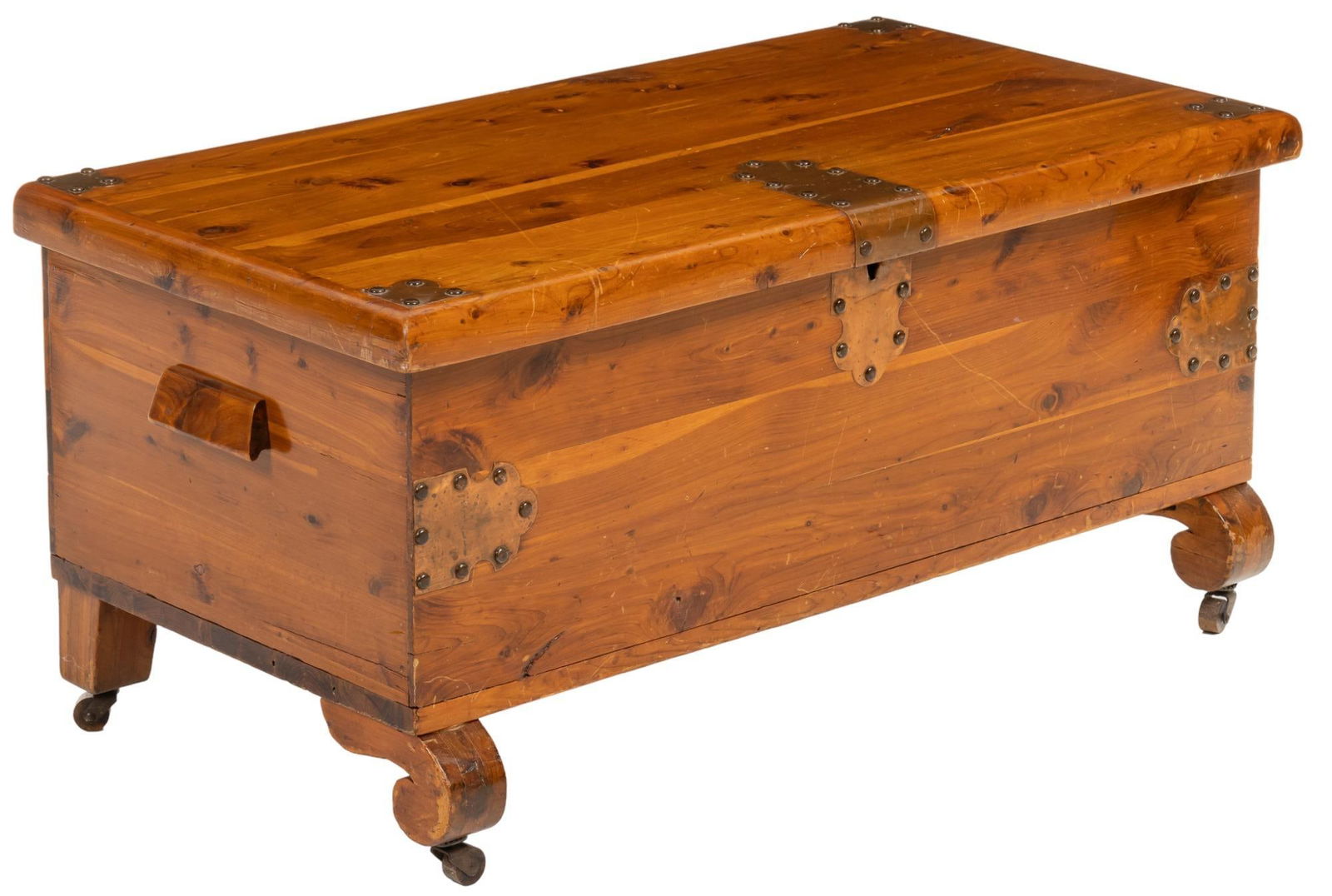 Pine Coffer: Small pine coffer with hinged lid and brass banding, raised on scrolled legs culminating in casters height 16 in. x width 34 in. x depth 17.5 in. We happily provide seamless shipping services on eve