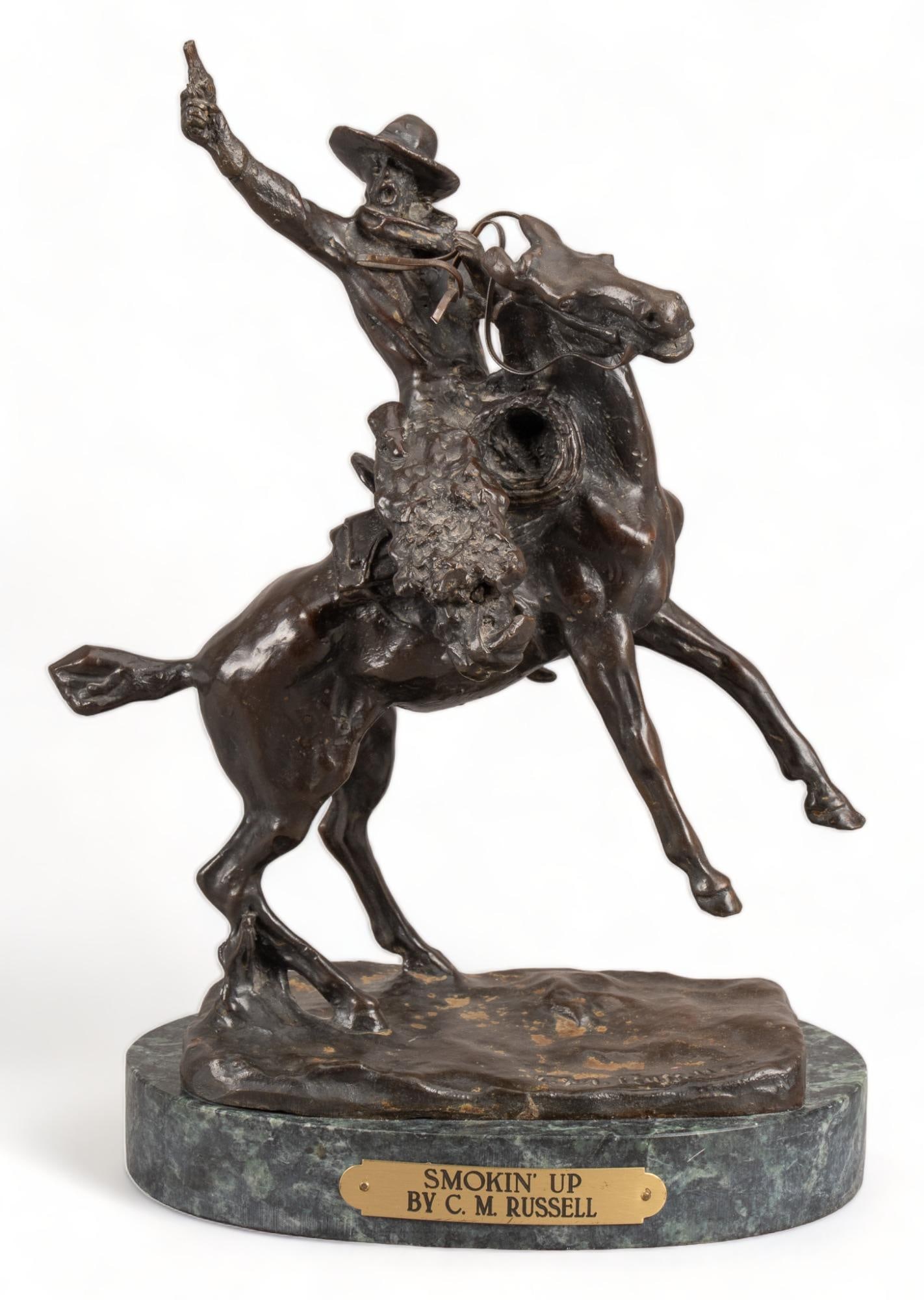 C. M. Russell, "Smokin' Up": Charles Marion Russell (Am. 1864-1926), "Smokin' Up", bronze recast sculpture on green marble base height 12.5 in. x width 9.5 in. x depth 5.5 in. We happily provide seamless shipping serv