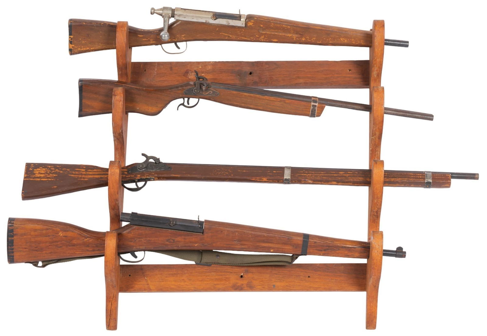 (4) Vintage Cap Guns and Wall Rack: Four vintage cap guns and wall rack, to include on Parris cap gun height 26 in. x width 22 in. x depth 6 in. We happily provide seamless shipping services on everything we sell. Please email us at s