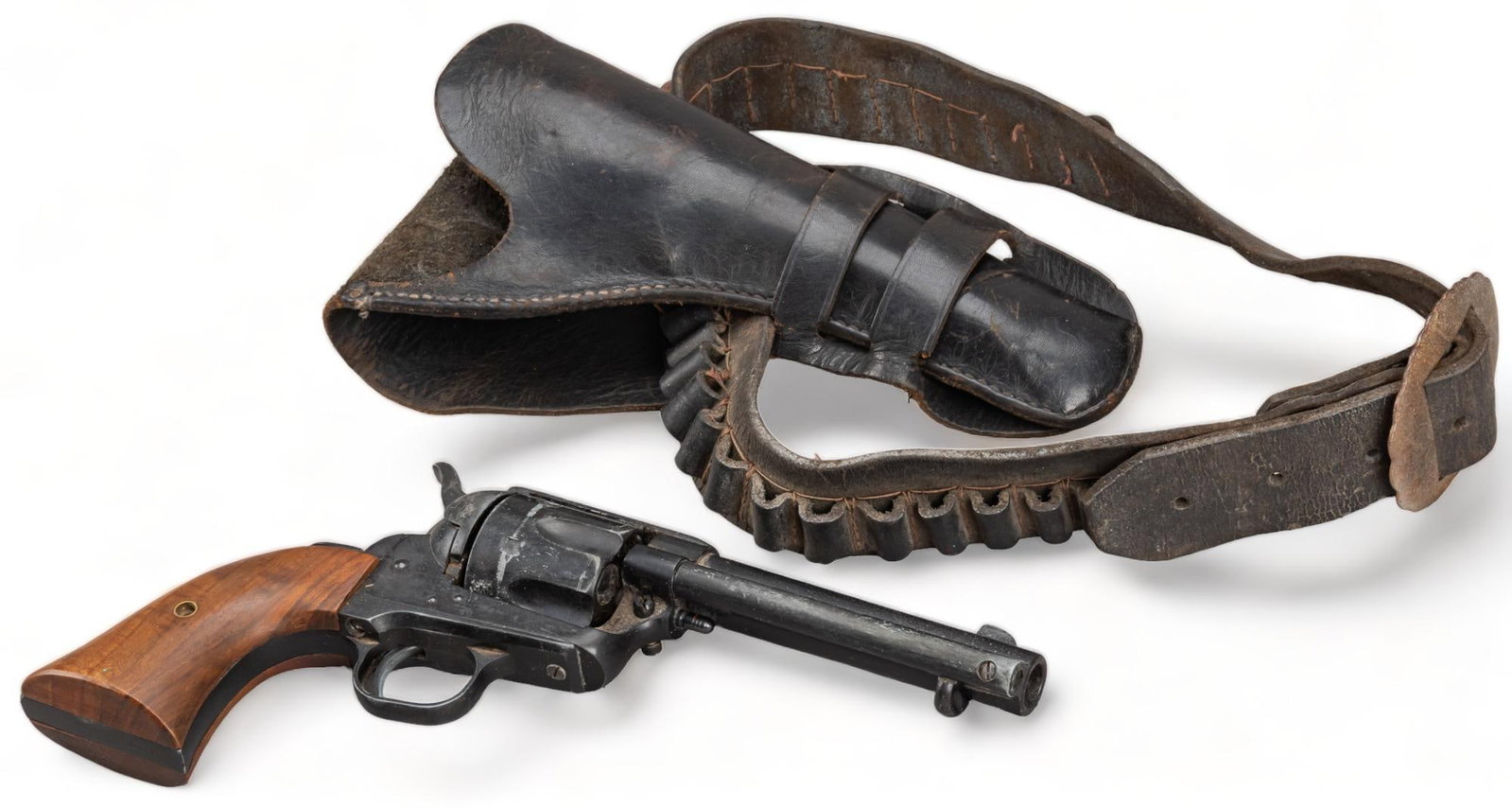 Vintage Holster and Prop Pistol: Vintage prop pistole and gun holster, with belt height 10 in. x width 5 in. x depth 1.5 in. / length of barrel to nozzle: 7.5 in. Provenance: A San Antonio, Texas collection We happily provide seamles
