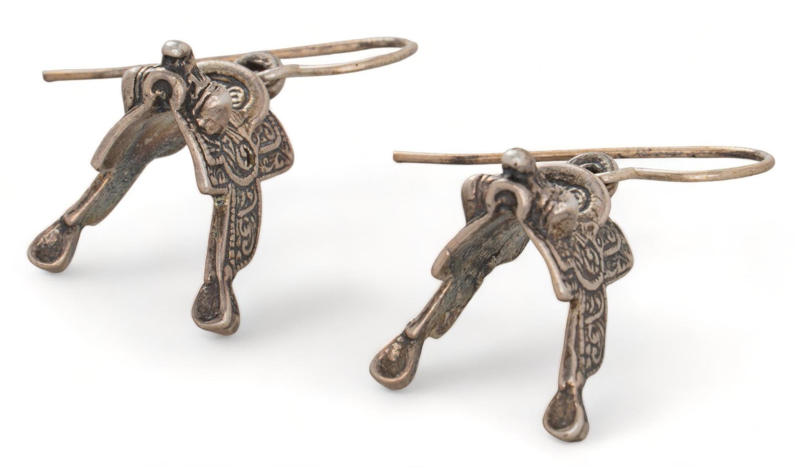 Sterling Silver Saddle Earrings: Sterling silver saddle earrings, hook backs, marked length 1.25 in. We happily provide seamless shipping services on everything we sell. Please email us at shipping@vogtauction.com or call 210-971