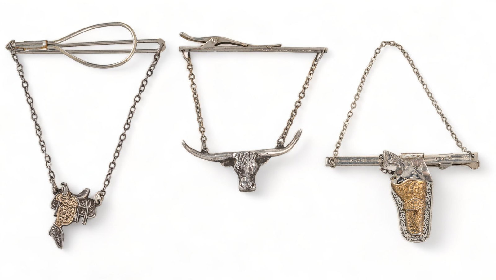 (3) Sterling Silver Western Tie Clips: Three (3) Western tie clips, one (1) sterling silver and 10K gold saddle tie clip, one (1) longhorn tie clip, one (1) sterling silver gun holster tie clip, marked saddle clip / length 4 in. longhorn c