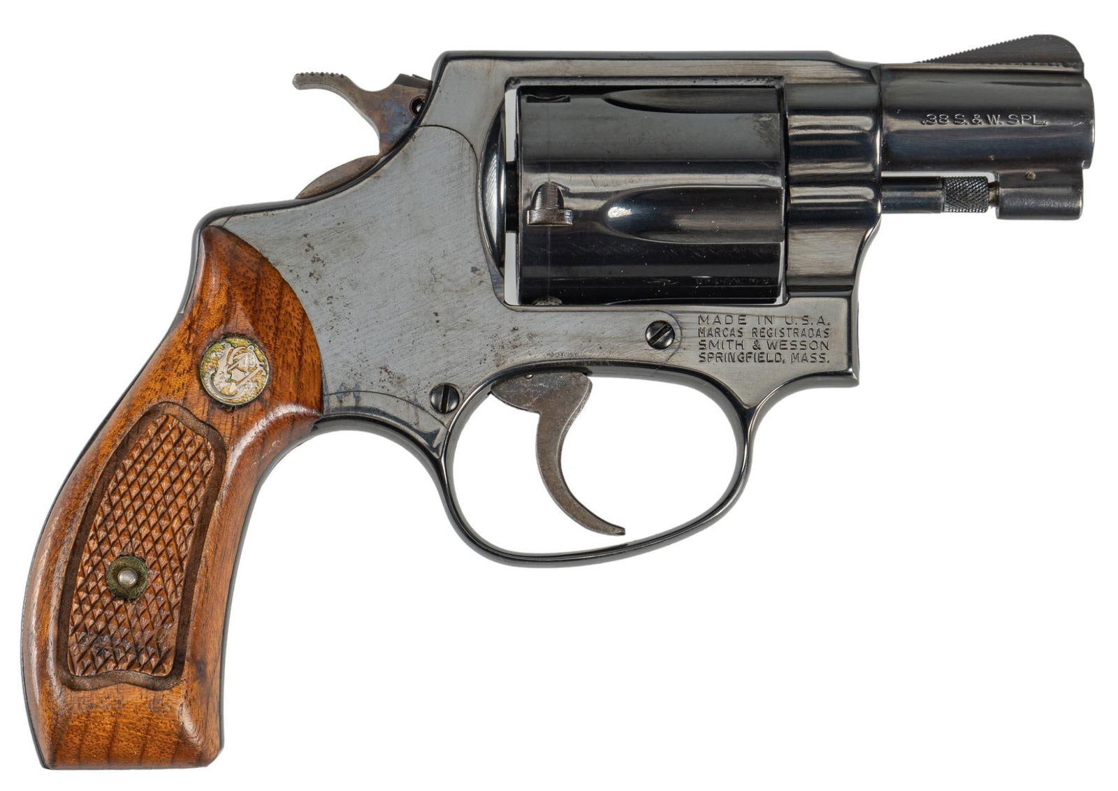 Smith & Wesson Model 36 38 Special Revolver: Serial: J979583 Manufacturer: Smith & Wesson Model: 36 Caliber: 38 S&W Special Barrel Length: 1.875 in. OAL: 6.25 in. Condition: Good; wood grips have moderate wear; barrel, frame & cyli
