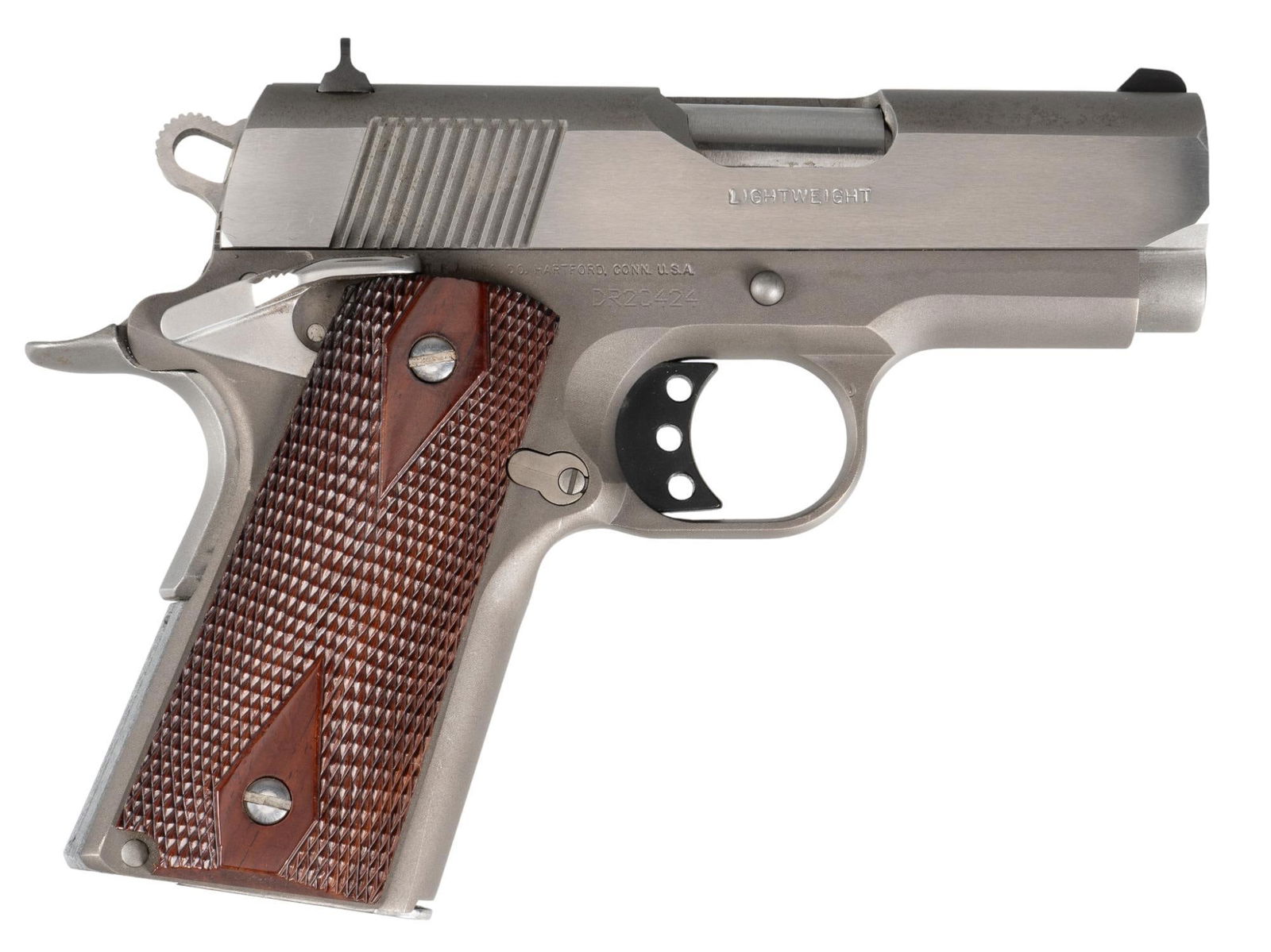 Colt Defender Series 90 Lightweight 45 ACP Semi Auto Pistol: Serial: DR20424 Manufacturer: Colt's PT. F.A. Mfg. Co. (c. 2000) Model: Defender Series 90 Lightweight Caliber: 45 ACP Barrel Length: 3 in. OAL: 7 in. Condition: Good; wood grips have very light h