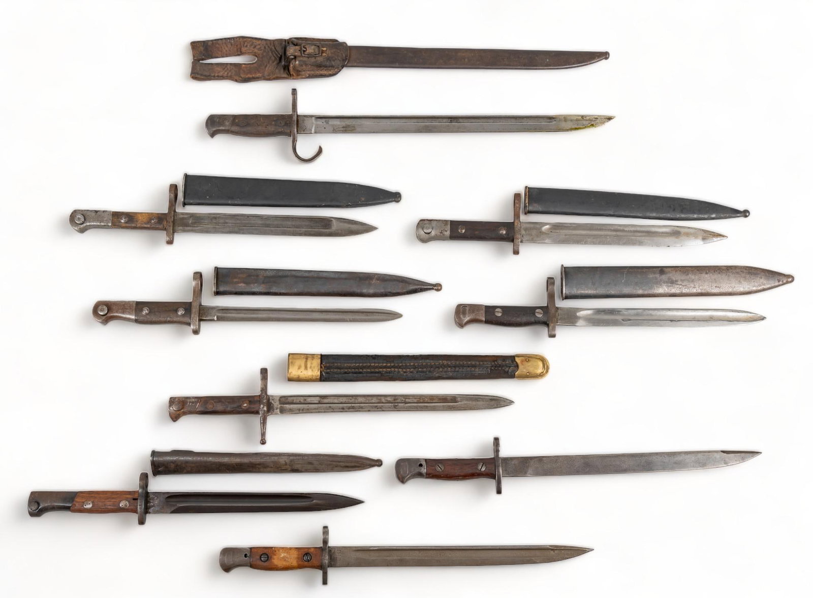 Collection of 9 Mixed Bayonets: Includes: -Italian Terni M1891 bayonet w/ scabbard -Indian MK I** RFI, DP '63 bayonet -Indian GRI MK II RFI 5-42 bayonet -Japanese Nogoya Toyoda Jidou Shokki Type 30 bayonet w/ scabbard & frog