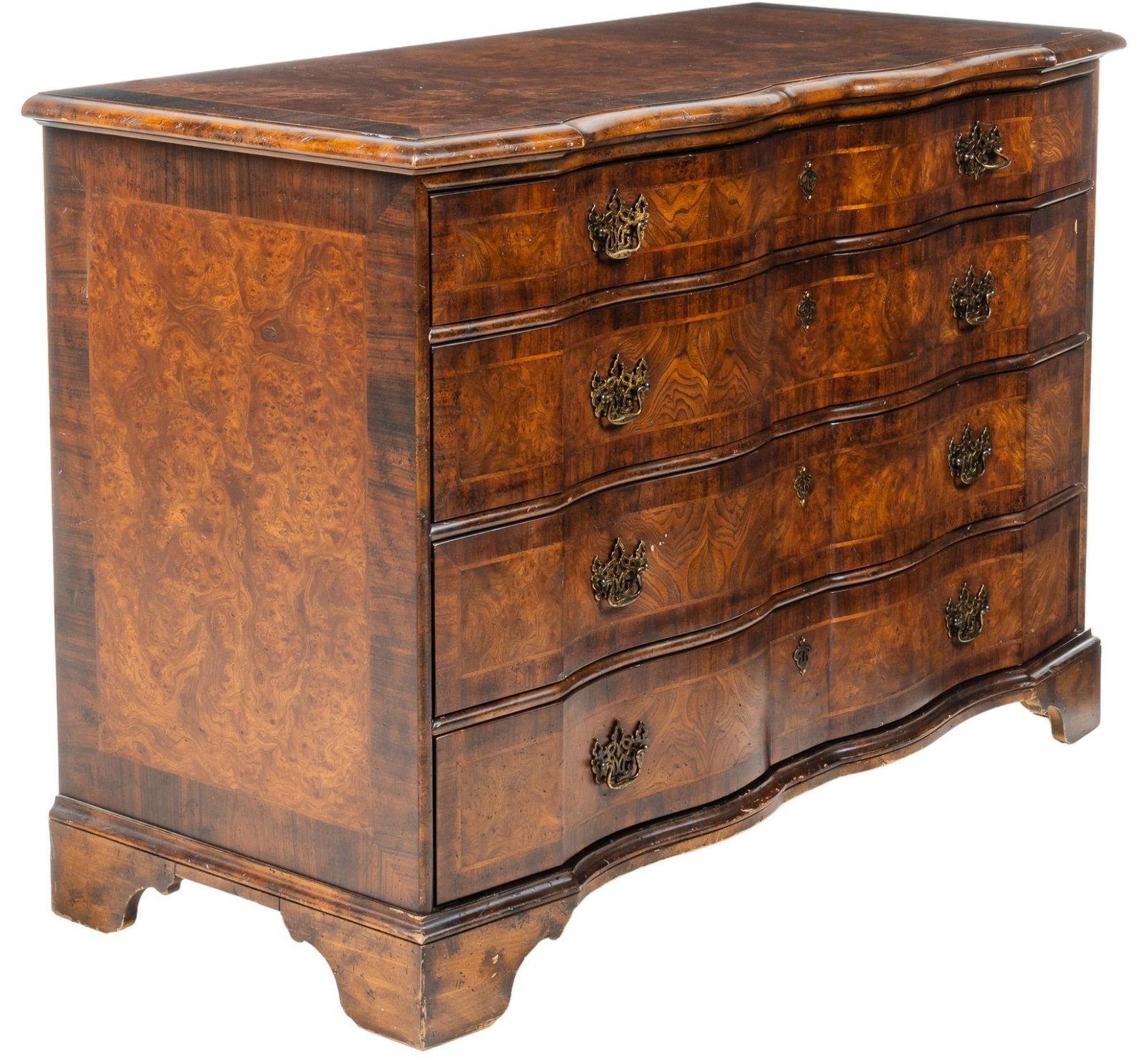 Inlaid Chest of Drawers: Chest of bowfront drawers, with overside top, above four stacked drawers with double ring pulls, featuring wood inlay throughout height 38 in. x width 54.5 in. x depth 25 in. Provenance: A prominent T