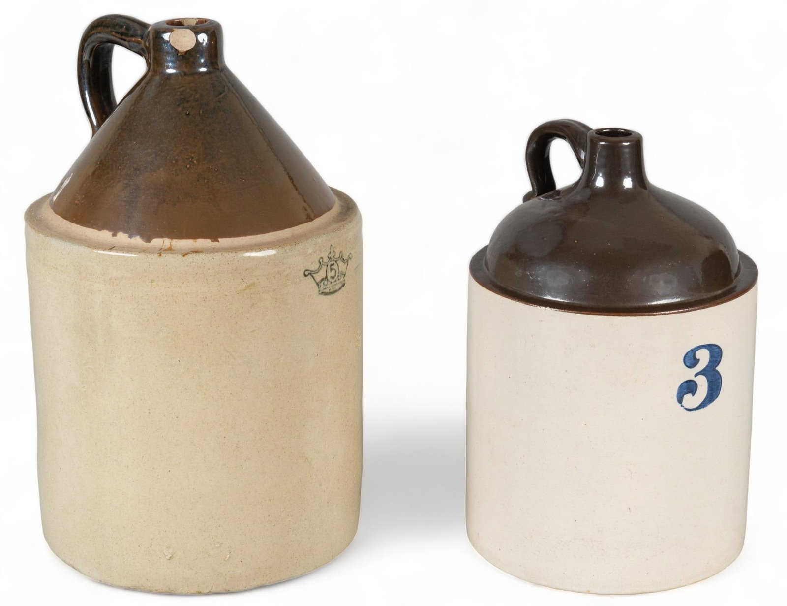 Pair of Vintage Stoneware Jugs: Pair of vintage stoneware jugs, one (1) five gallon Robinson Ransbottom jug, one (1) three gallon jug, brown and cream, marked height 19 in. x width 11 in. x depth 11 in. / largest Provenance: Propert