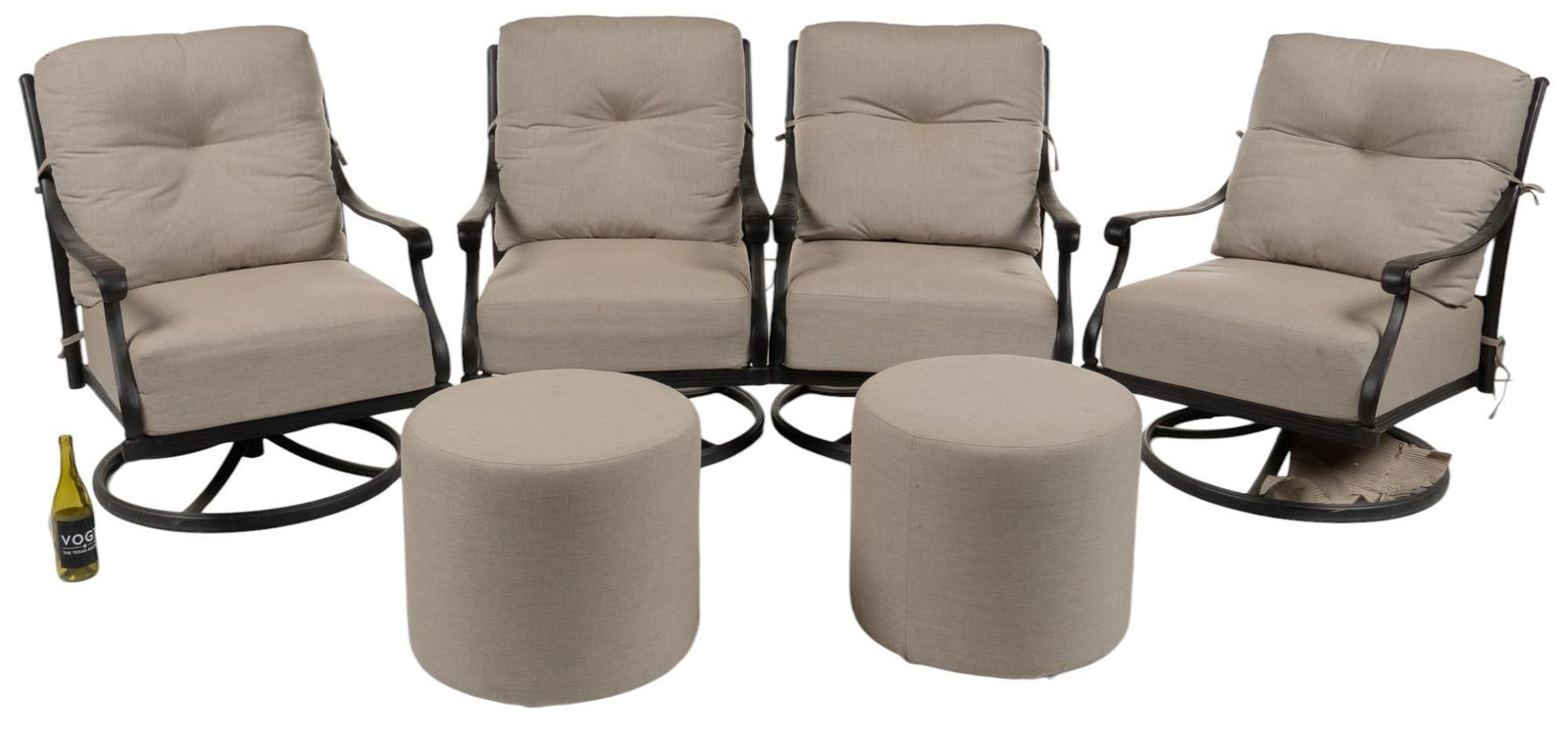 Set of Patio Chairs and Ottomans: Set of four iron patio chairs, with scrolled armrests, with removable seat and back cushions, rising on swiveling bases, also includes two matching cylindrical foot rests. height 37 in. x width 27 in.