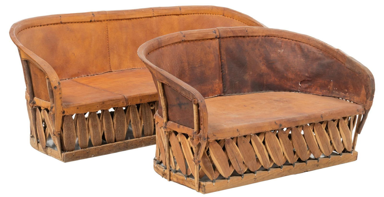 Pair of Mexican Equipale Settees: Pair of Mexican equipale settees, both with barrel backs, tanned pigskin upholstery, supported on Mexican cedar bases height 29.5 in. x width 53.5 in. x depth 29 in. Provenance: Property from a San