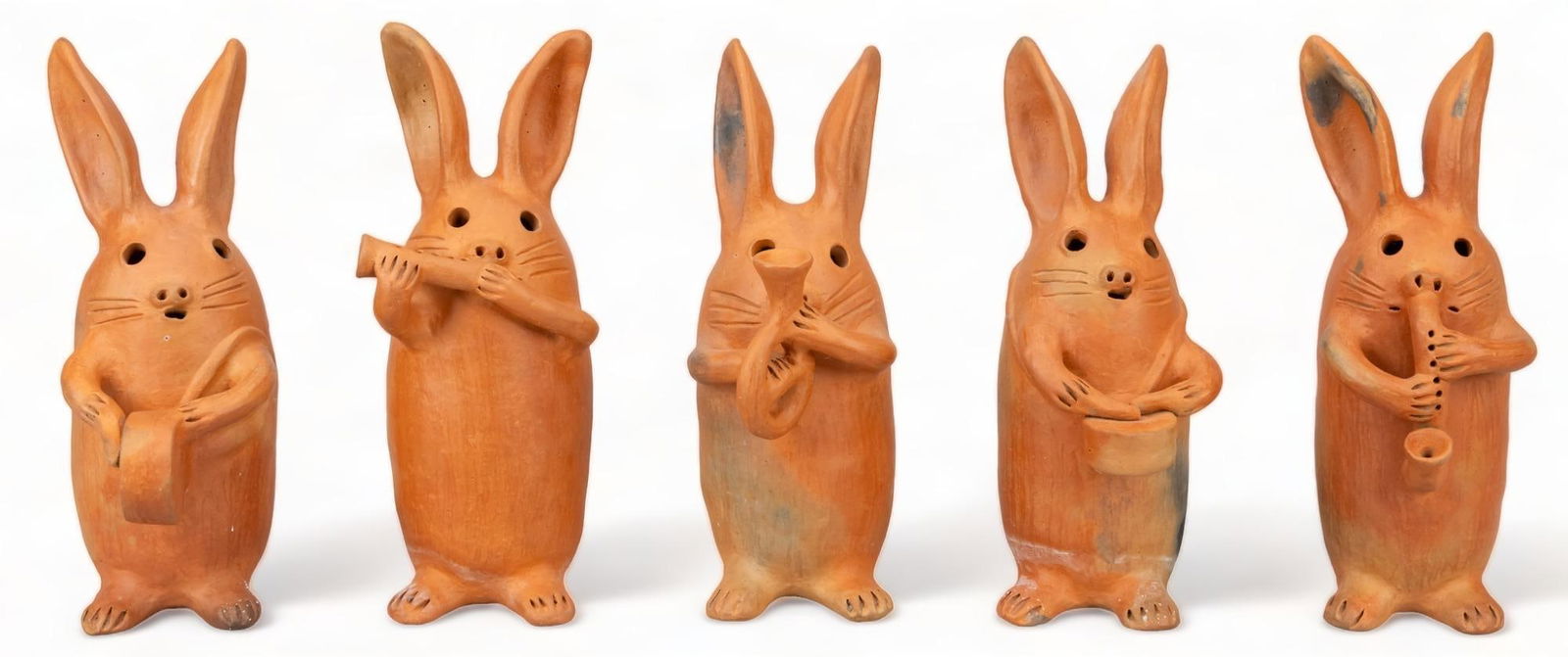Jose Gonzalez Mendez, Conejo Band: Jose Gonzalez Mendez, five bunny statues, each one playing an instrument, modeled clay, unglazed height 12.5 in. x width 5 in. x depth 7 in. / tallest Provenance: Property from the life-long Mexican