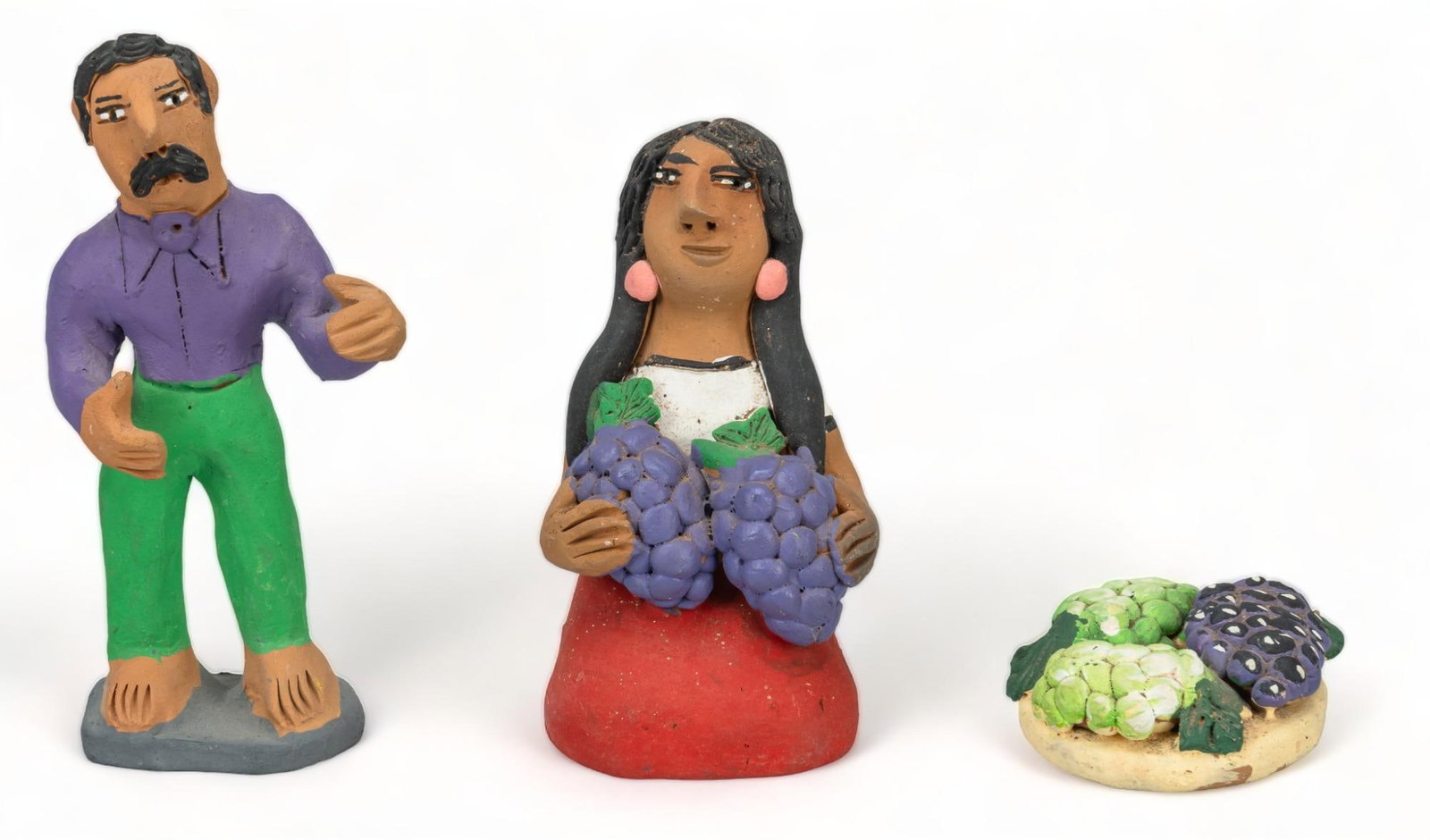 Josefina Aguilar, Grape Harvesters: Josefina Aguilar (b. 1945, Oaxaca, Mexico), ceramic munecas, depicting a man and woman gathering grapes, hand-modeled and painted, signed "Josefina Aguilar" height 5 in. x width 2.5 in. x dept