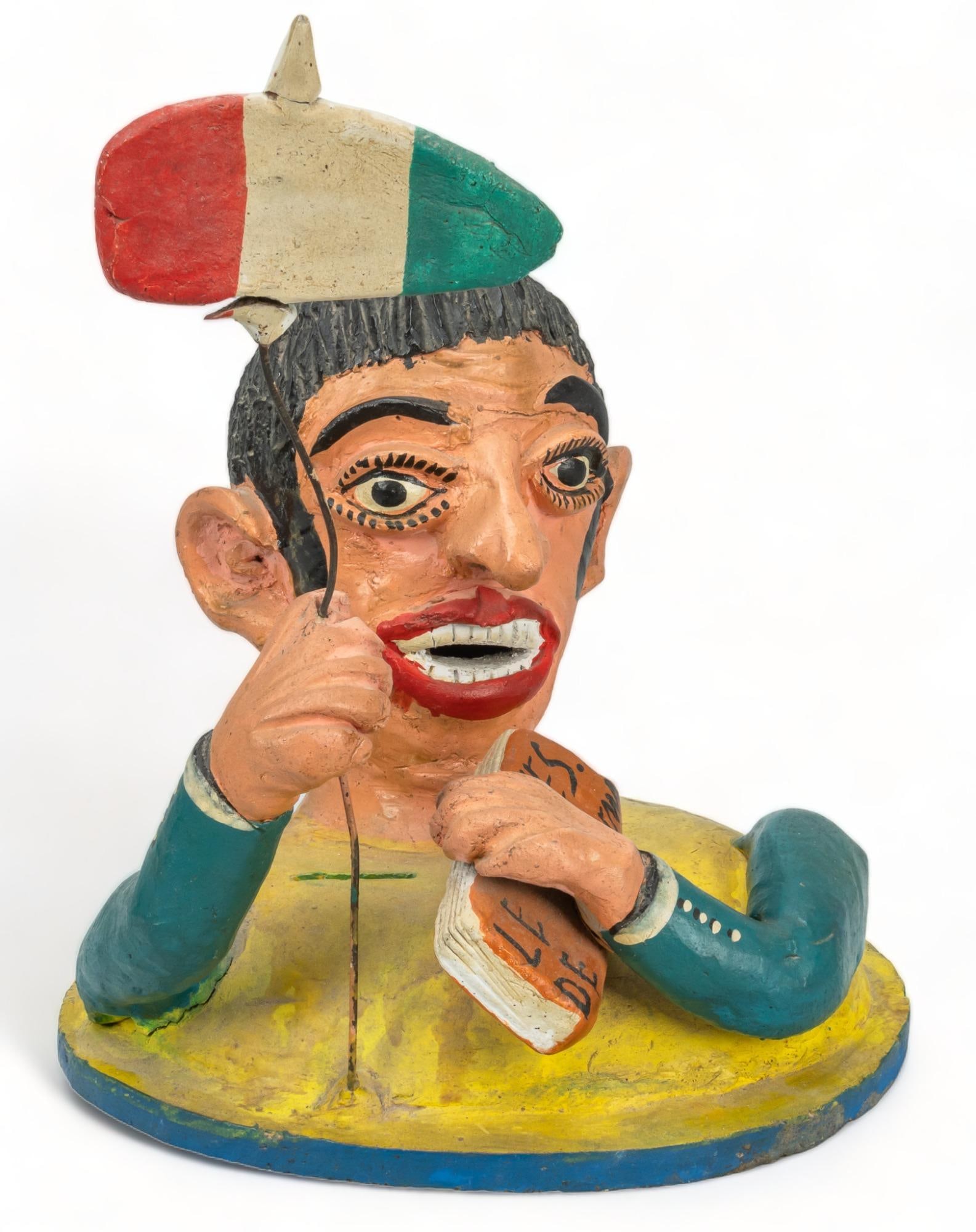 Vintage Betus Clay Portrait Bust: Vintage Portrait bust (Santa Cruz de las Huertas, Jalisco), modeled betus clay, painted polychrome, depicting a figure holding a banner and a book height 11.5 in. x width 9 in. x depth 8.5 in. Prove