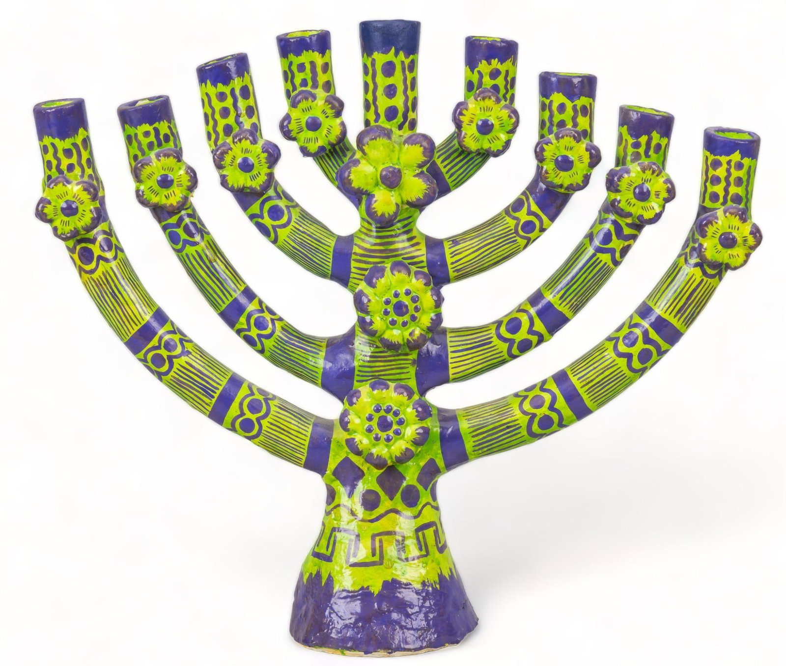 Tree of Life Candelabra: Tree of life candelabra (Izucar de Matamoros, Puebla), featuring eight arms, supporting nine candles, with green and purple painted accents height 11.5 in. x width 13.5 in. x depth 4 in. Condition: Re