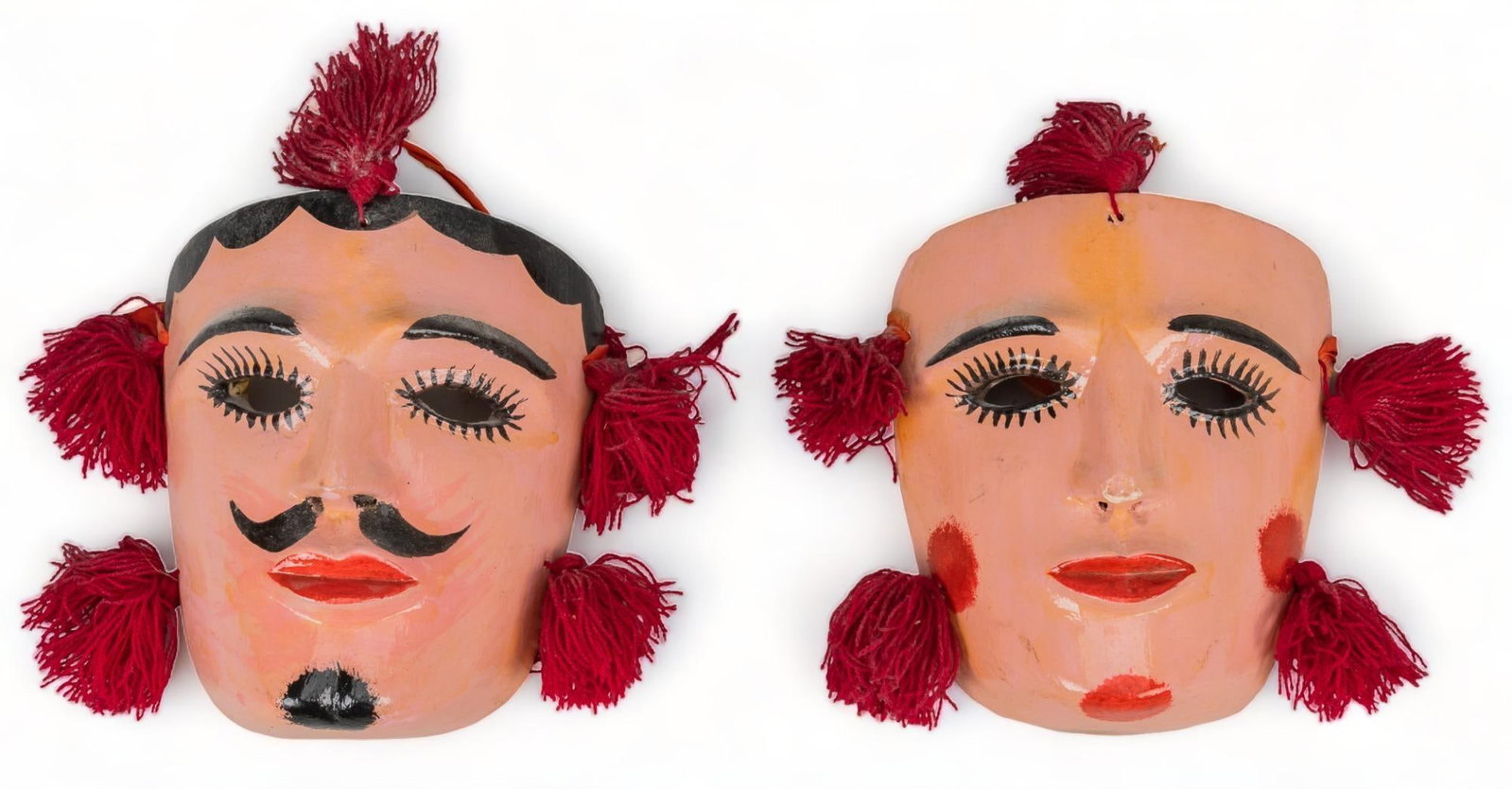 Pair of Mexican Tejoneros Dance Masks: Pair of Mexican Tejoneros dance masks, includes a man and woman, hand-carved and painted with tassels height 7 in. x width 8 in. x depth 3 in. / each Provenance: Property from the life-long Mexican fo