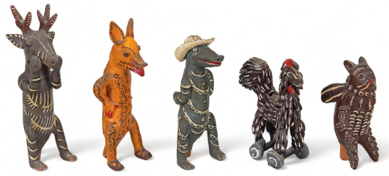 Set of (5) Ocumichu Whistles: Set of five vintage Ocumichu whistles, modeled clay, with painted accents, depicting fantastical anthropomorphic figures height 9.5 in. x width 3 in. x depth 3 in. Provenance: Property from the life