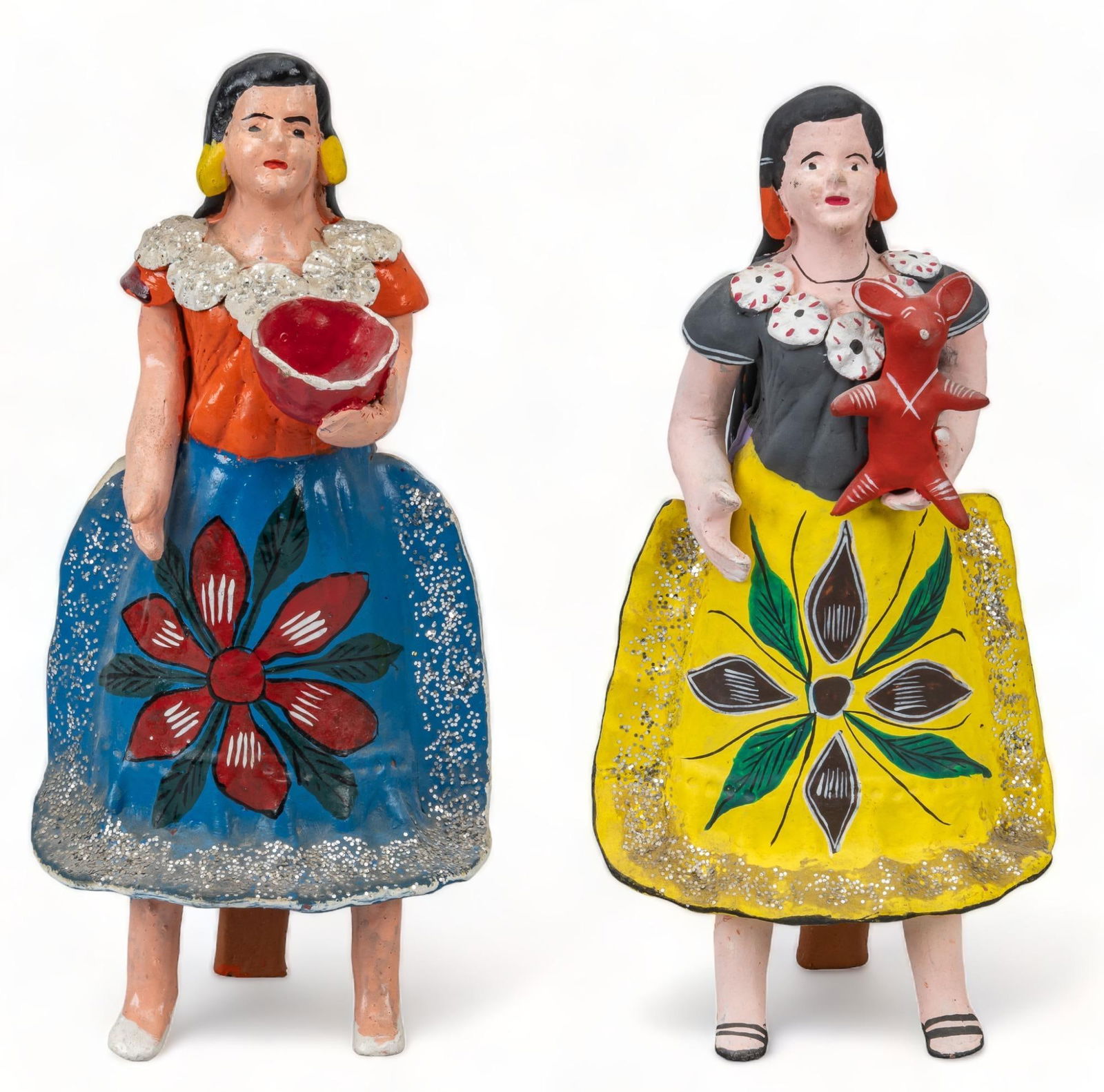 Pair of Vintage Figural Coin Banks: Pair of vintage figural coin banks (Puebla), molded and modeled clay, with painted and glazed accents, floral motifs and glitter trim height 11.5 in. x width 5 in. x depth 4 in. / tallest Provenance