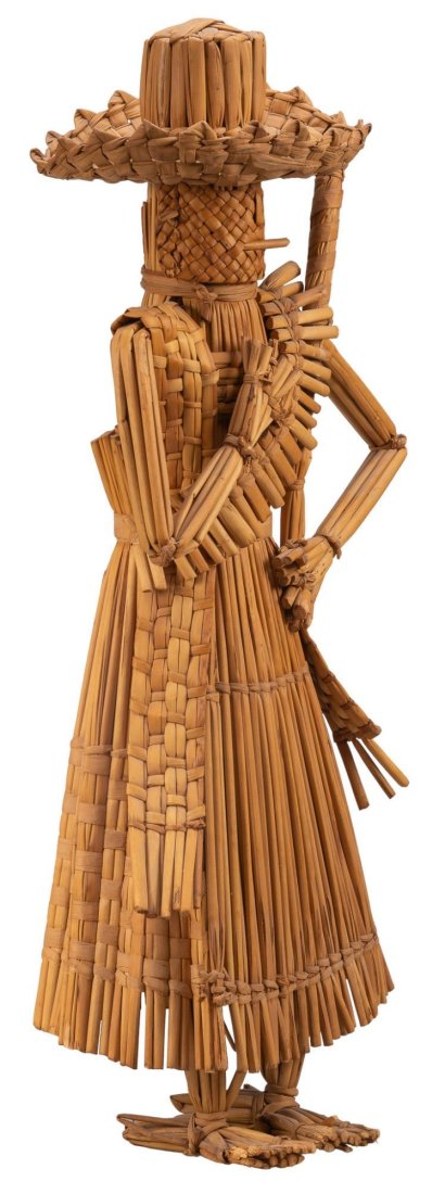 Straw Adelita: Large Adelita figure, made from woven reeds and straw, not freestanding height 29 in. x width 12.5 in. x depth 7 in. Provenance: Property from the life-long Mexican folk art collection of Margaret an