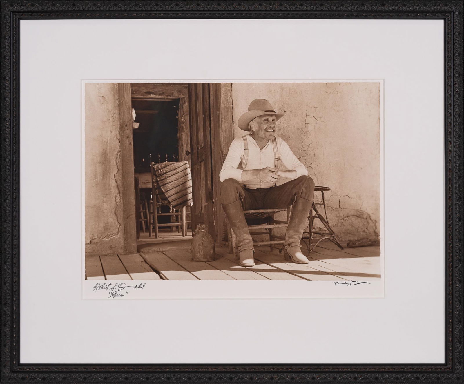 "Gus on the Front Porch", Lonesome Dove Double Signed Bill Wittliff Photograph: Bill Wittliff (1940-2019, USA) "Gus on the Front Porch", 1988, photograph of Robert Duvall as Gus McCrae from the "Lonesome Dove" television miniseries (1989), sepia-toned, framed and matted by John S