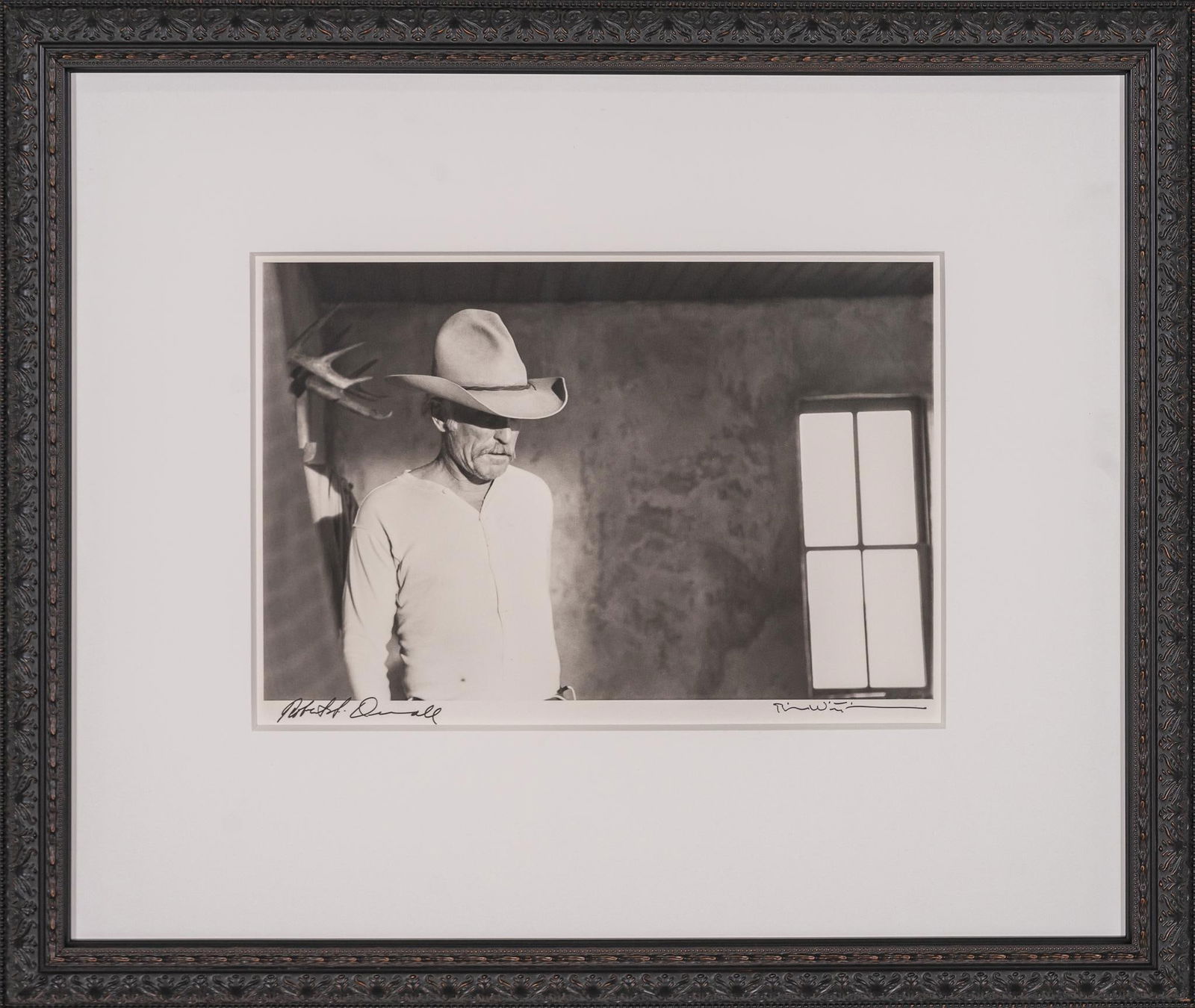 "Augustus", Lonesome Dove Double Signed Bill Wittliff Photograph: Bill Wittliff (1940-2019, USA) "Augustus", 1988, photograph of Robert Duvall as Gus McCrae from the "Lonesome Dove" television miniseries (1989), framed and matted by John Scott (Austi