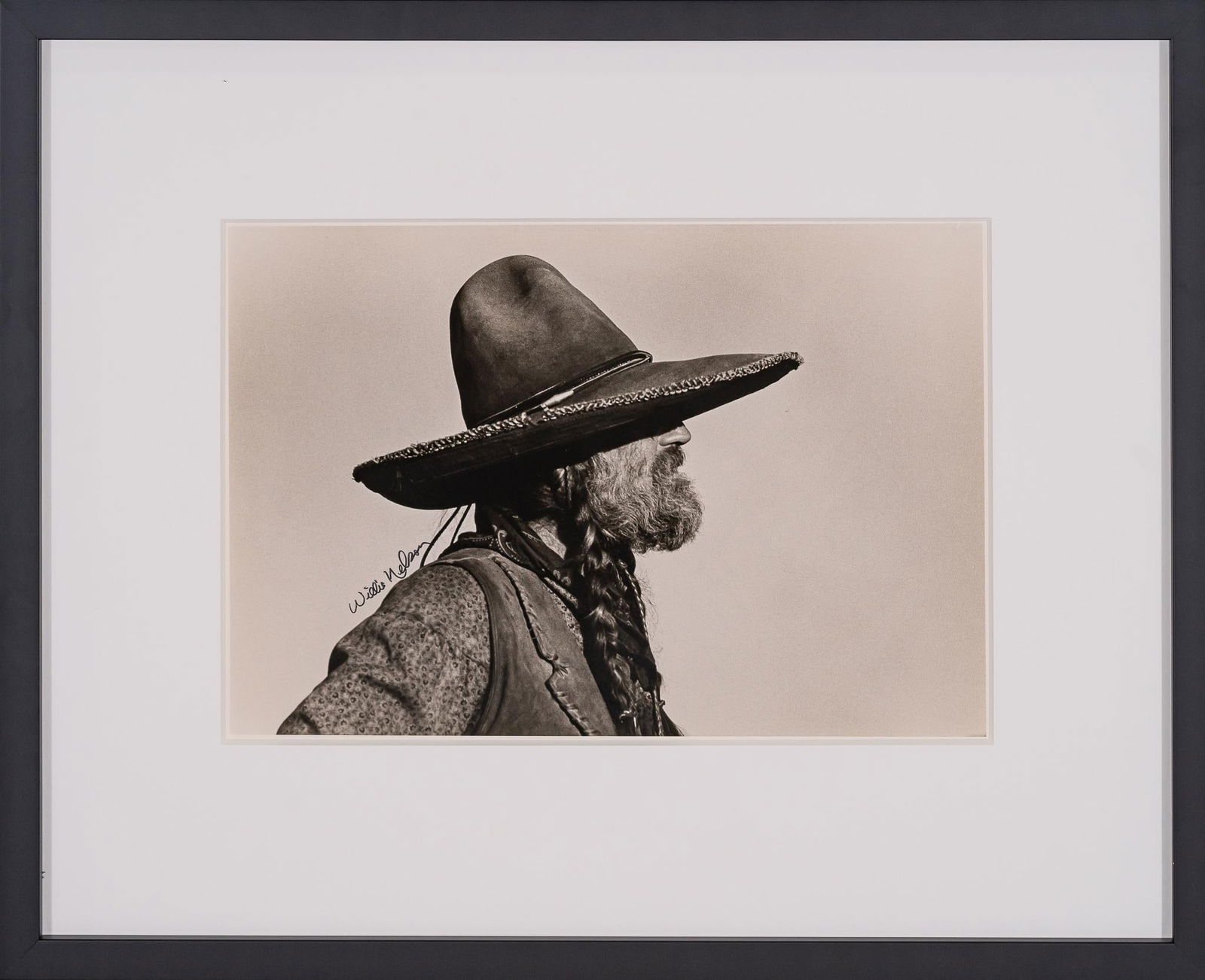 Willie in Hat, "Barbarosa", Signed Bill Wittliff Photograph: Bill Wittliff (1940-2019, USA) Willie in hat, from the production of "Barbarosa" (1982), photograph of country musician and actor Willie Nelson (USA), 20th century, framed and matted by John Scott (Au