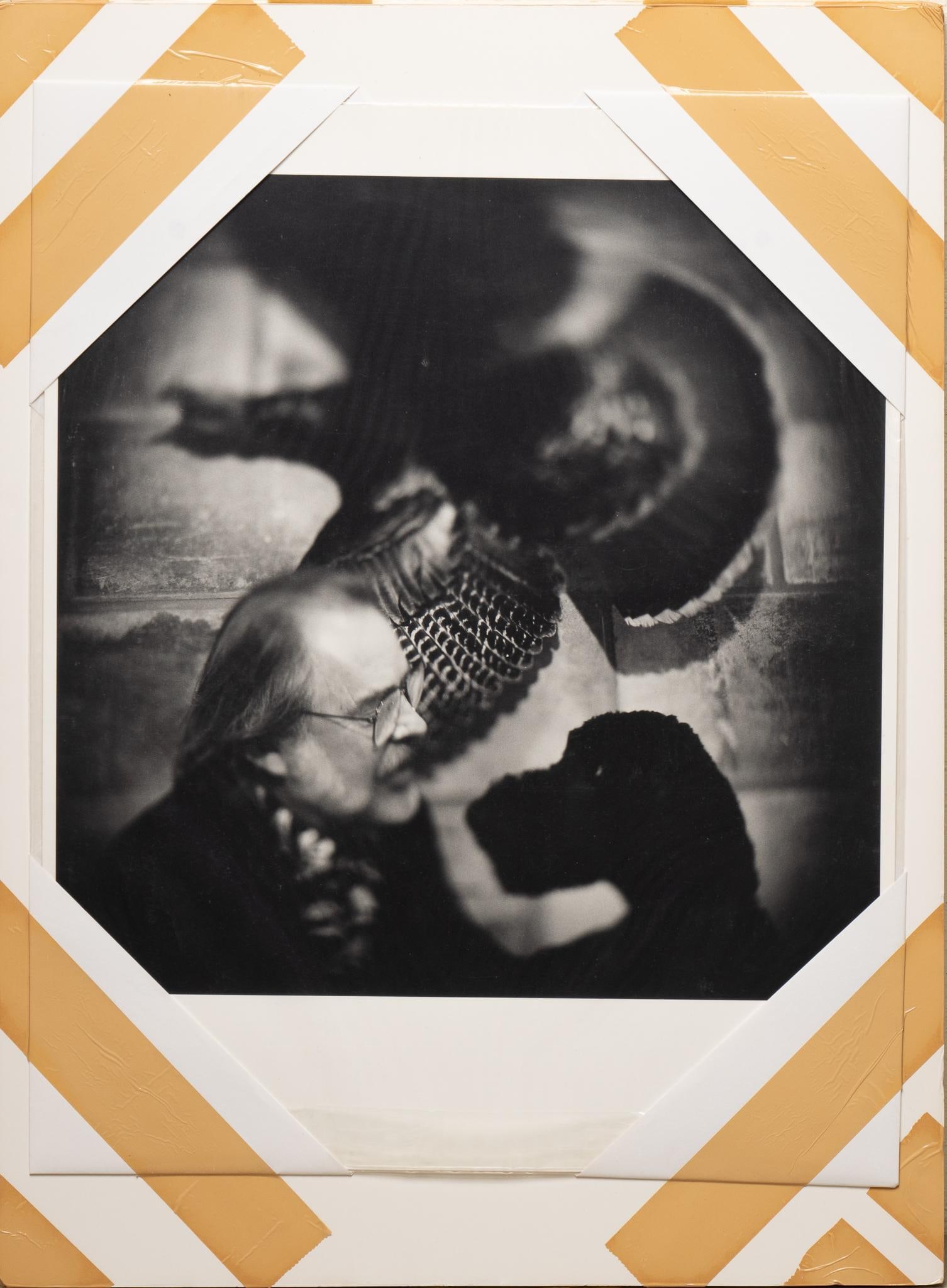 Photograph Portrait of Bill Wittliff and His Dog: Black and white photography portrait of Bill Wittliff and his dog (Ocho) in front of a wild turkey taxidermy mount, taped to matting size: 20 x 16 in Provenance: Property from the personal estate coll