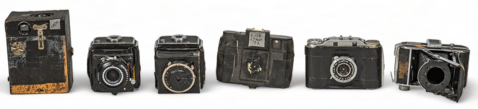 Collection of (6) Vintage Cameras: Collection of six vintage film cameras, used by Bill Wittliff, with several examples being homemade pinhole cameras, created by Mr. Wittliff by removing and joining together parts from other cameras h