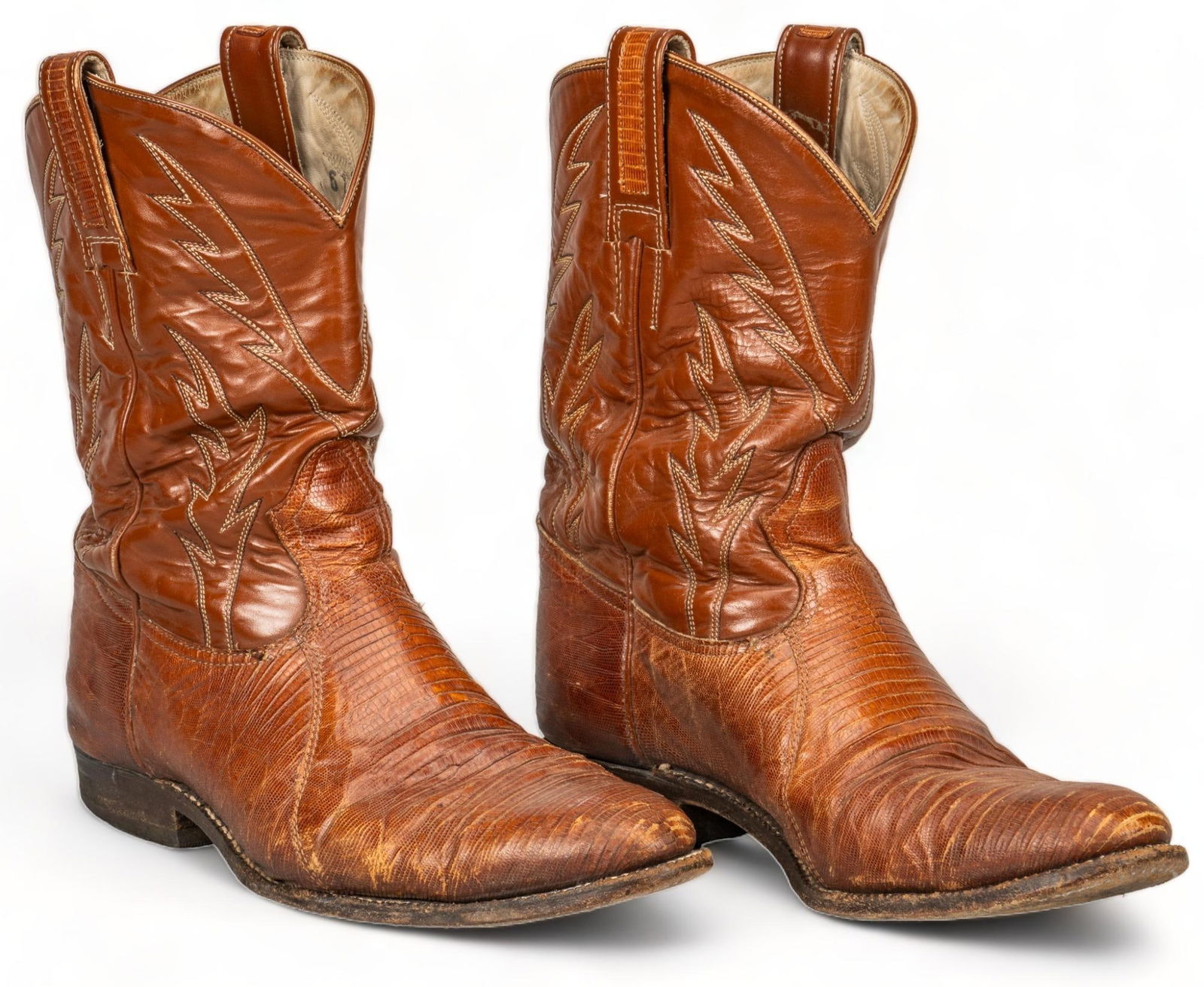 Pair of Lizard Skin Cowboy Boots: Pair of Chris Romero handcrafted lizard skin cowboy boots height 11 in. x width 4 in. x depth 11.5 in. Provenance: Property from the personal estate collection of noted photographer and screenwrite
