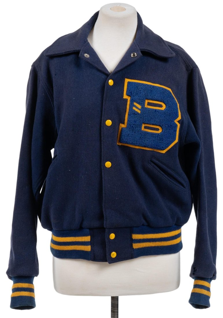 Bill Wittliff's Vintage Letterman Jacket: Bill Wittliff's vintage high school letterman jacket, featuring large stitched "B", with yellow accents, featuring stitched "Billy Wittliff" label in right-hand pocket, with silver fabric inner lining