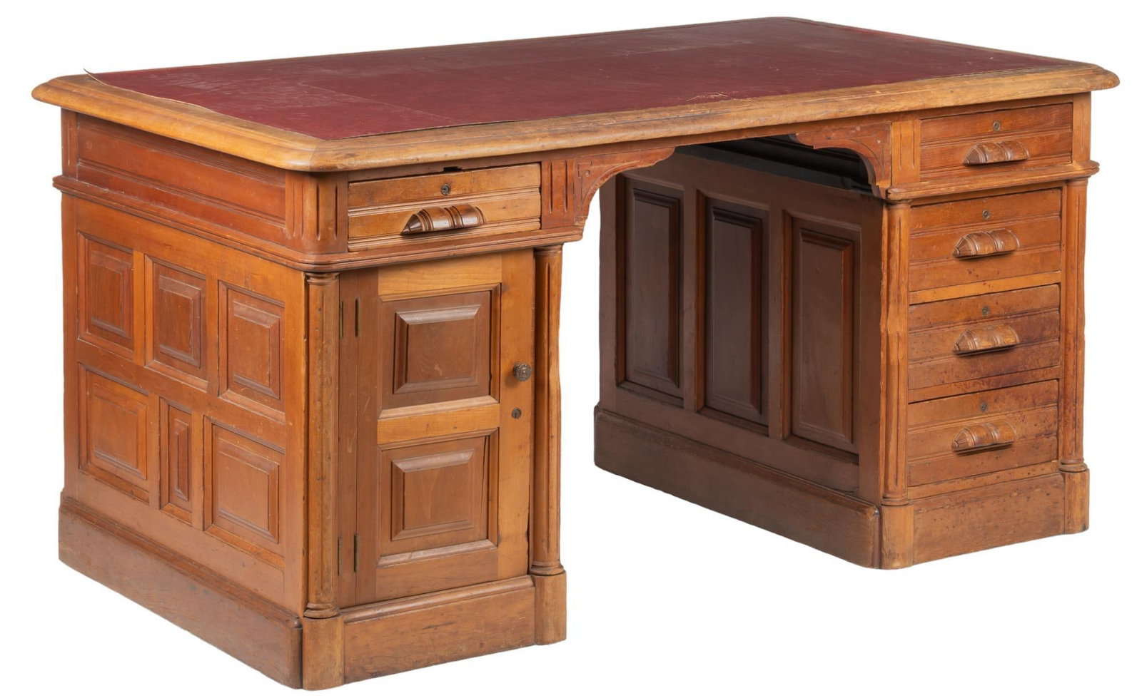 Bill Wittliff's Writing Desk: Bill Wittliff's writing desk, with large large top, supported on two pedestal bases, one with four stacked drawers, one with a single drawer, over cabinet door opening to interior storage, used by