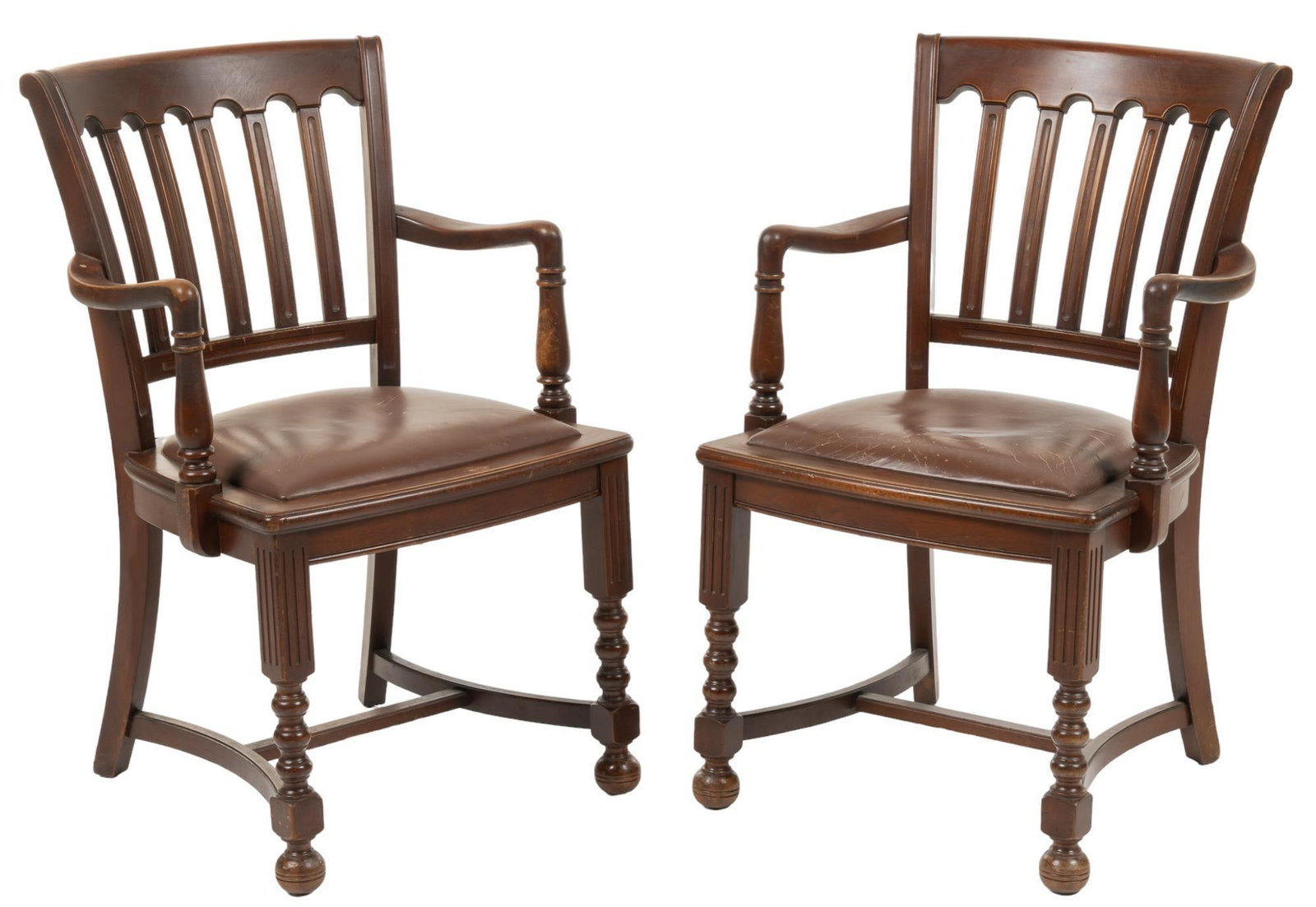 Pair of American Desk Chairs: Matched pair of wooden American desk chairs, each with slat back, scrolled arms, cushioned seat and turned legs, used by Bill Wittliff in his downtown Austin, Texas office height 35.5 in. x width 22 i