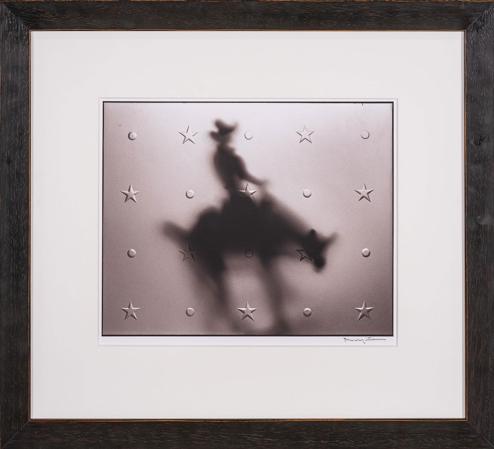 Horseback, Signed Bill Wittliff Photograph: Bill Wittliff (1940-2019, USA) alone, 20th century photograph of the blurred silhouette of a cowboy on bucking horseback, with star and dot shape raised detailing, framed and matted by John Scott (Aus
