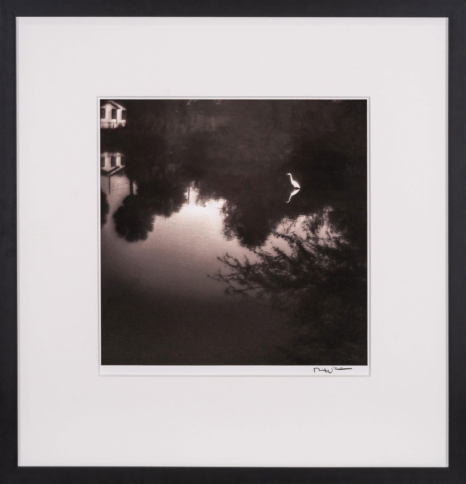 Alone, Signed Bill Wittliff Photograph: Bill Wittliff (1940-2019, USA) alone, 20th century photograph of a solitary crane standing in a reflective body of water, framed and matted by John Scott (Austin, Texas) under museum glass, hand-signe
