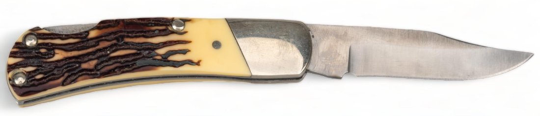 Bear MGC Folding Lonesome Dove Knife: Includes: Bear MCG Cutlery folding clip point knife with faux stag horn grip in custom Lonesome Dove belt holster, holster made by R. Sullivan, of Lufkin Texas height 5 in. x width 4 in. / case blade 