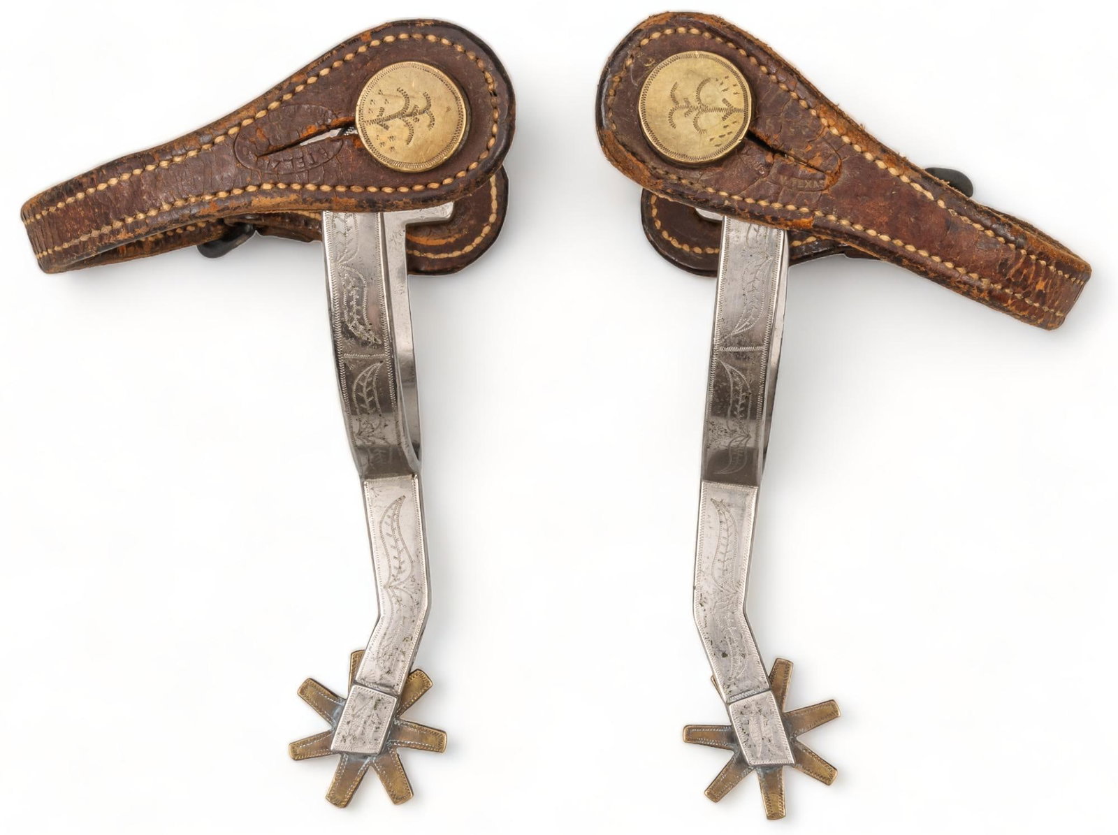 Pair of Huntsville Prison Spurs: Pair of Huntsville (Texas) prison style spurs, featuring abalone inlaid mountings spur length: 5.5 in. x width 3.25 in. rowel diameter: 1.5 in. Provenance: Property from a home in the Alamo Heights ne