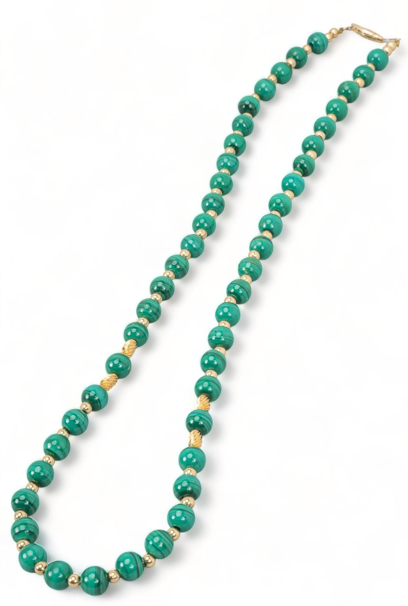 Malachite and 14K Gold Bead Necklace: Malachite and 14K gold bead necklace, pearl clasp, marked length 23 in. Provenance: Property from a San Antonio, Texas collection We happily provide seamless shipping services on everything we sell