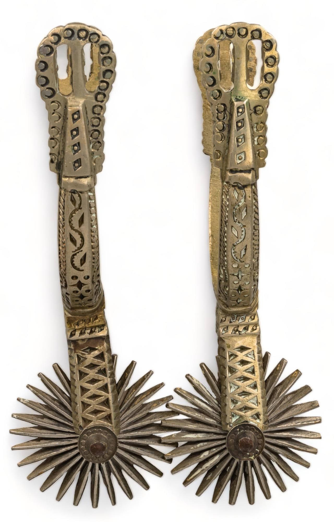 Pair of Brass Cowboy Spurs: Pair of brass cowboy spurs, likely from Mexico, with tooled and fretted heel bands, each marked "0000", 28 point rowels Provenance: Property from a Truchas, New Mexico collection We happily pr