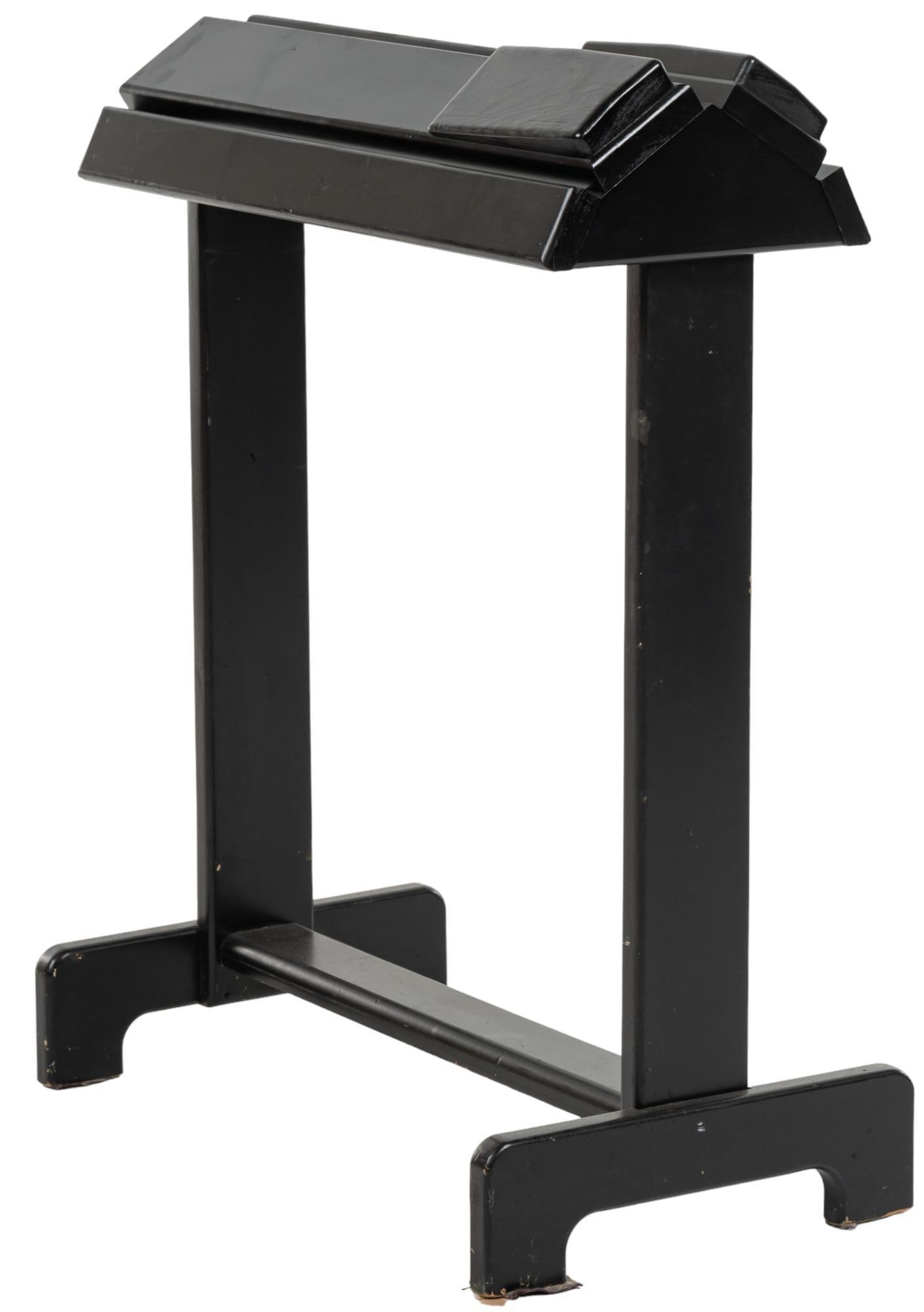 Saddle Stand: Wooden saddle stand, designed by a cabinet maker, black paint, on trestle legs height 43 in. x width 19.5 in. x depth 36 in. Provenance: Property from a home in the Alamo Heights neighborhood of San A
