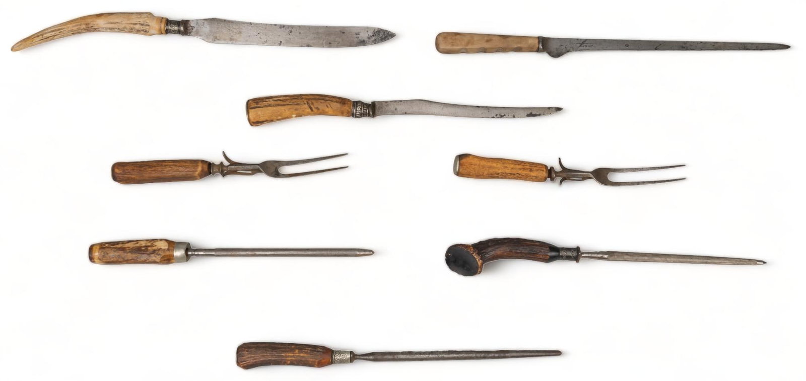Collection of 8 Antique Rustic Carving Cutlery: Includes: -2 x carving forks: unmarked w/ antler handles -3 x sharpening rods: 1 marked "Lee's" w/ sterling collar; 2 x unmarked w/ sterling collar; all have antler handles -3 x carving kn