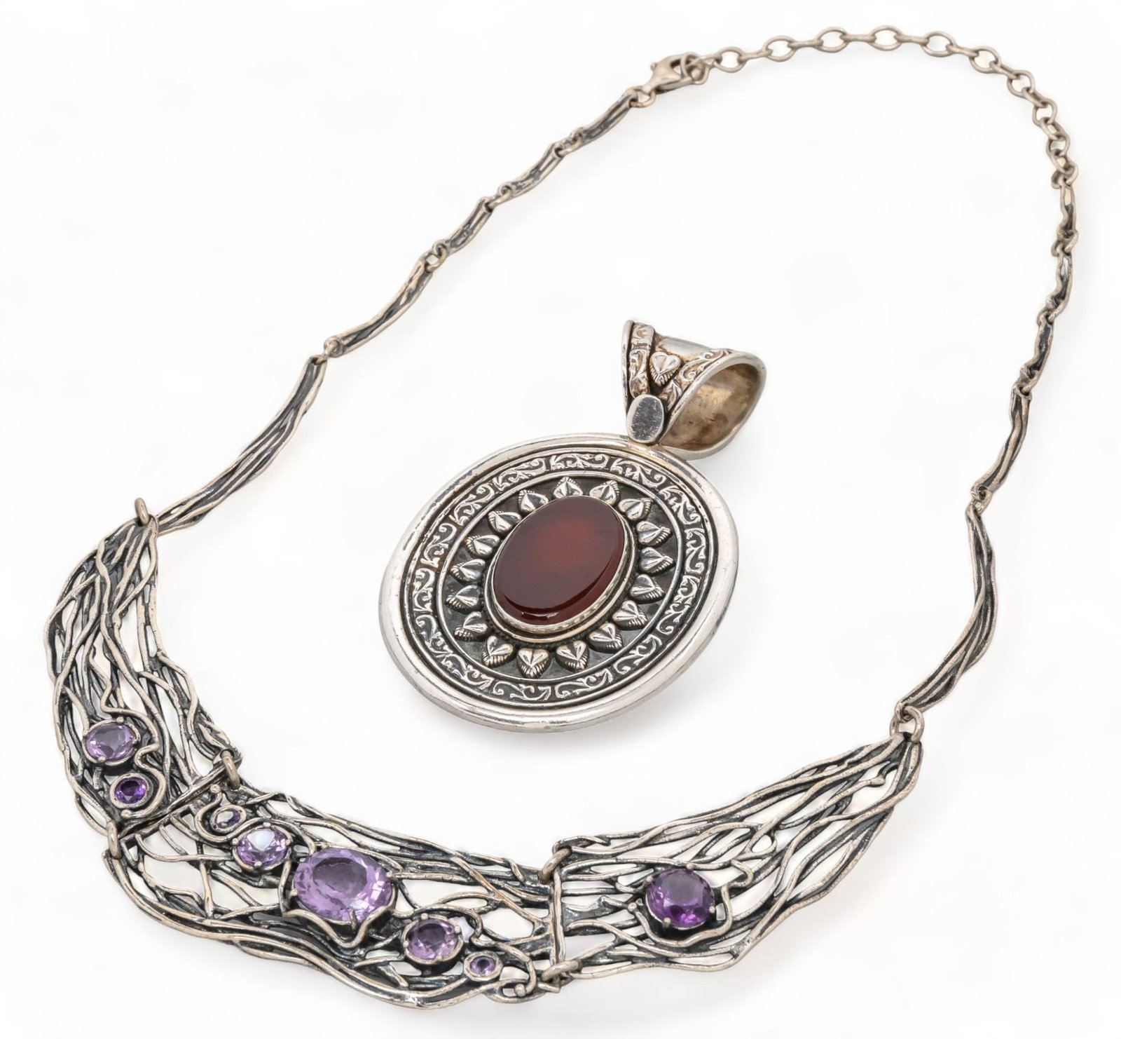 (2) Carnelian Sterling Silver Pendant and Amethyst Woven Necklace: Two (2) carnelian sterling silver pendant and amethyst woven necklace, one (1) sterling silver carnelian central stone pendant with sunflower motif and heart bail, one (1) sterling silver Carolyn Poll