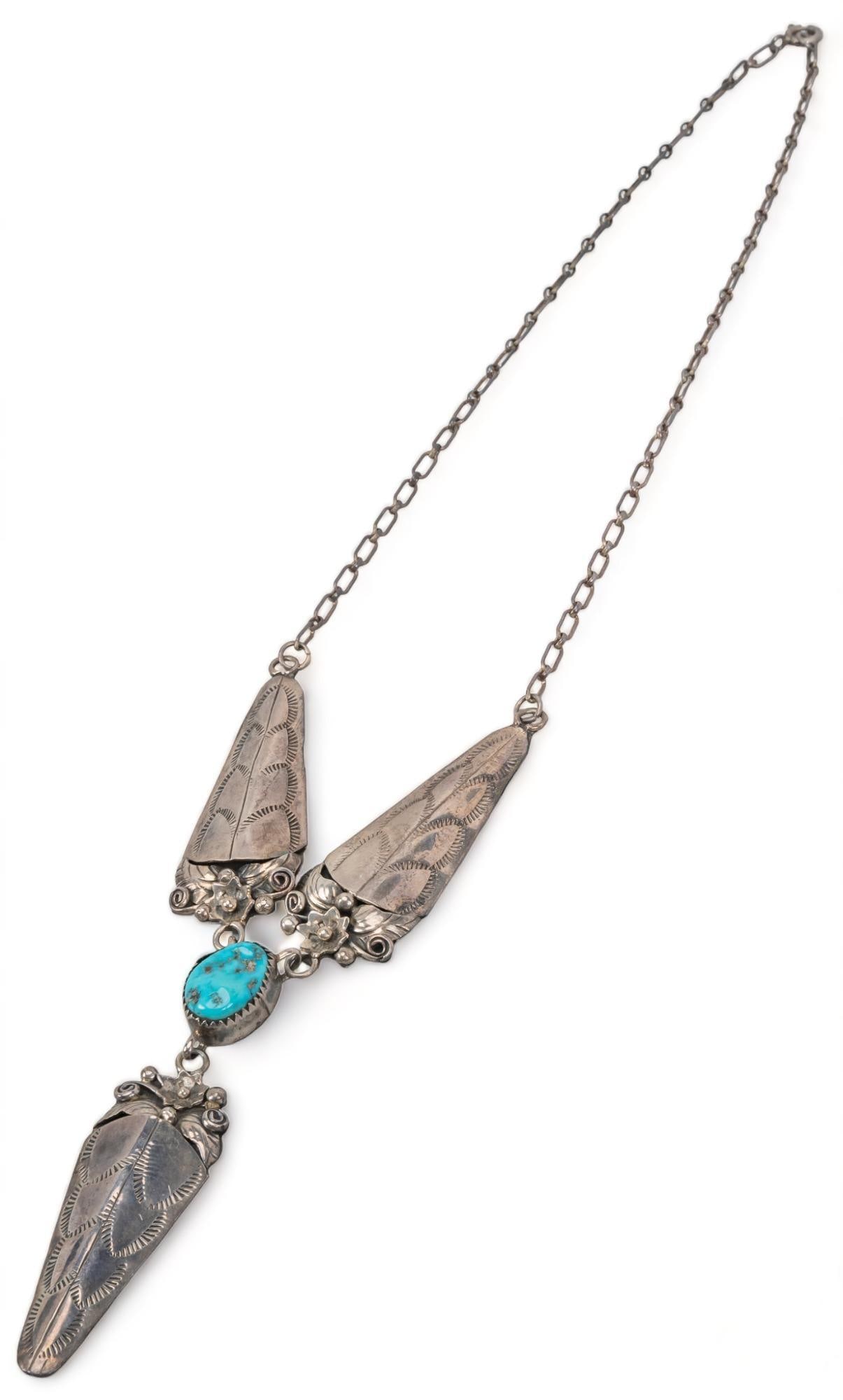Turquoise Sterling Silver Drop Pendant Necklace: Turquoise sterling silver drop pendant necklace, floral scroll work, marked " D" length 17 in. drop 3 in. total weight: 25 grams Provenance: Property from a Truchas, New Mexico collection We
