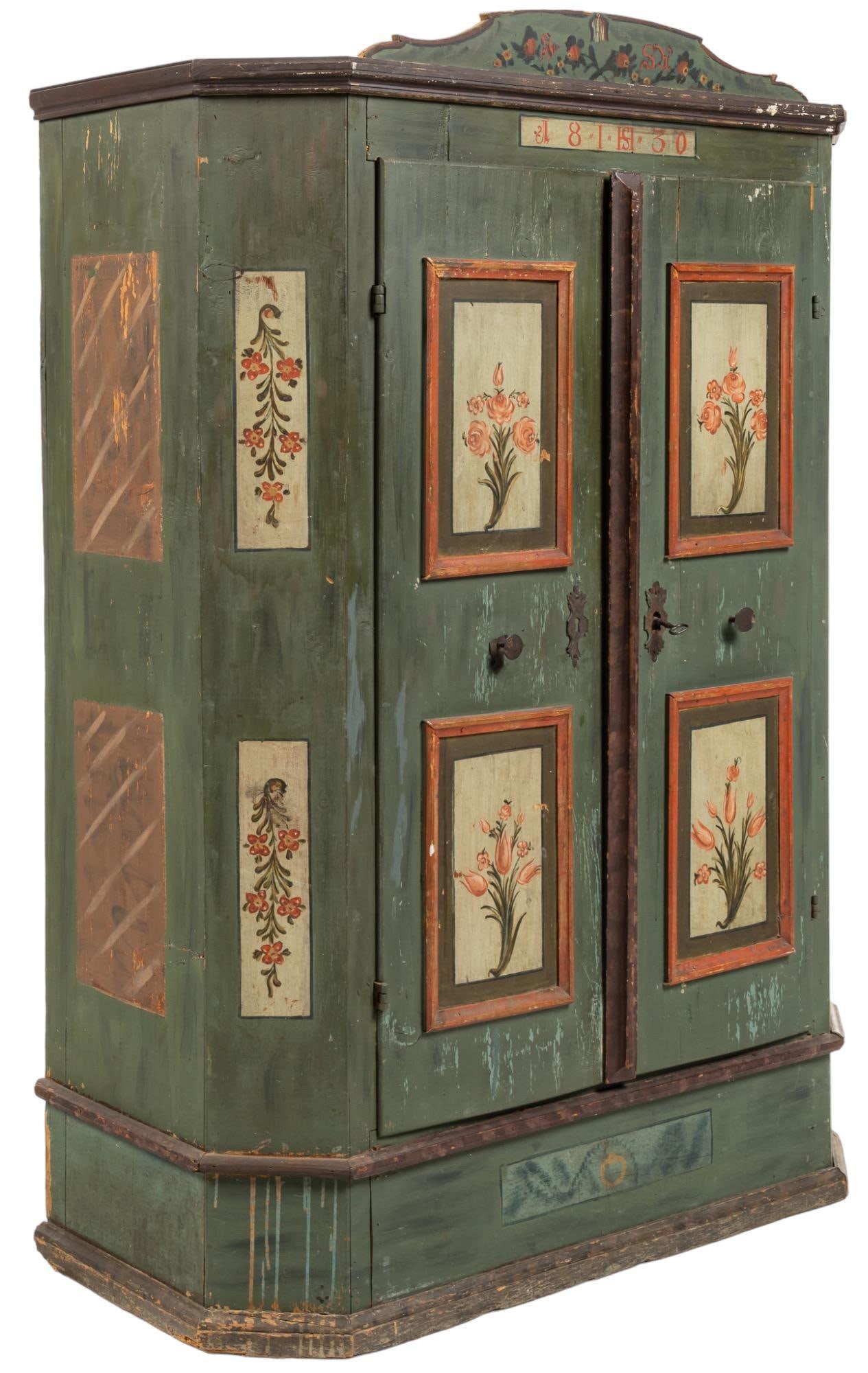 Painted Folk Art Cabinet: Large painted folk art cabinet, hand painted floral designs throughout, two doors with metal hardware open to open interior height 71 in. x width 51 in. x depth 22 in. Provenance: Property from a Sp