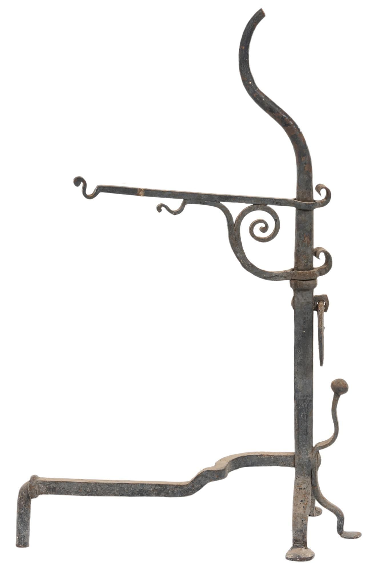 Wrought Iron Pot Stand: Wrought pot stand, with scrolled motifs, swinging arm height 46 in. x width 12 in. x depth 28 in. Provenance: Property from the estate of long-time antiques dealer Nancy Kendall, Blanco, Texas We h