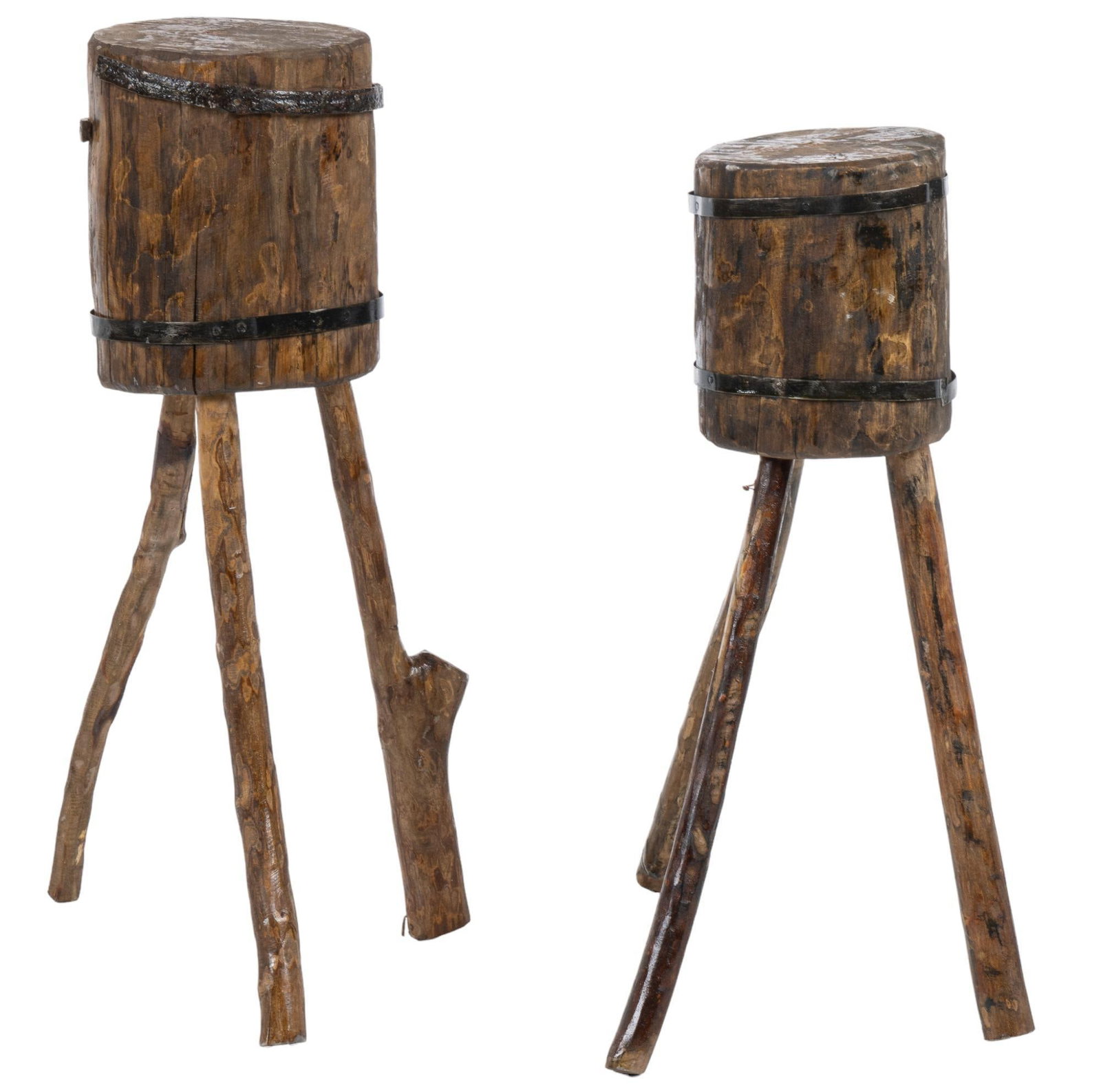 (2) Butcher's Blocks: Two primitive butcher's blocks, each featuring iron banded log table base, supported on splayed living edge legs. height 33 in. x width 15 in. x depth 15 in. / tallest block We happily provide sea
