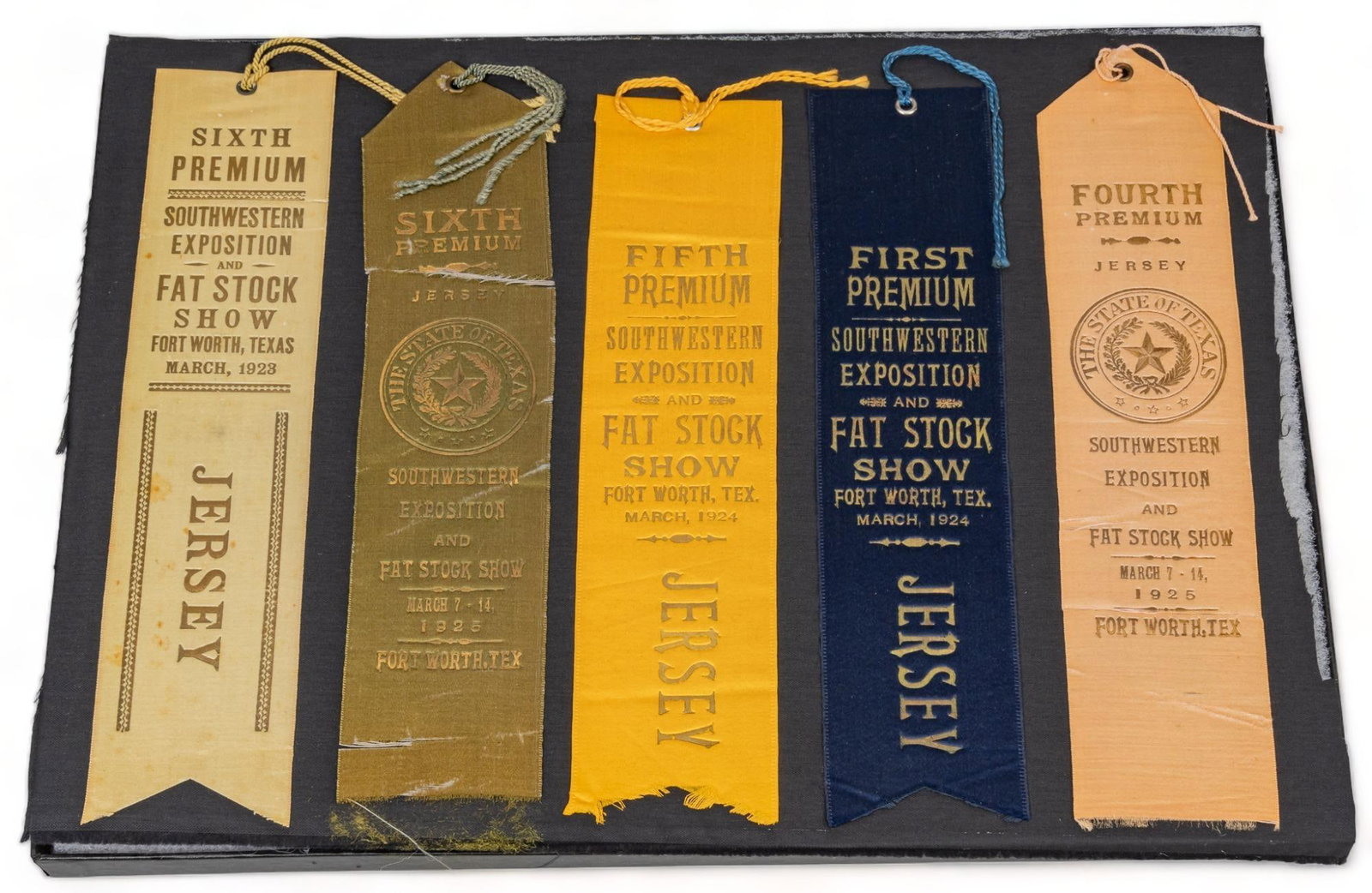 Display of (5) Vintage Stock Show Ribbons: Display of five vintage Southwestern Exposition and Fat Stock award ribbons, with dates ranging from 1923 through 1925 height 12 in. x width 16 in. x depth 1 in. / display case Provenance: Property fr