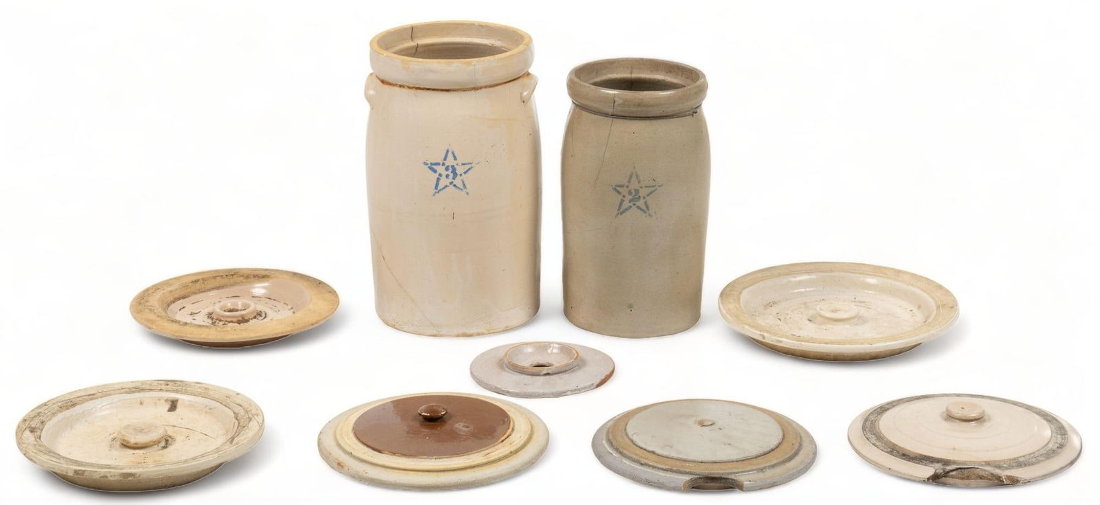 Collection of Stoneware Pottery: Collection of stoneware pottery, to include two Star Pottery crocks, one 3-gallon, one 2-gallon, both salt glazed with cobalt blue mark, also to include an assortment of stoneware lids height 15.5 in