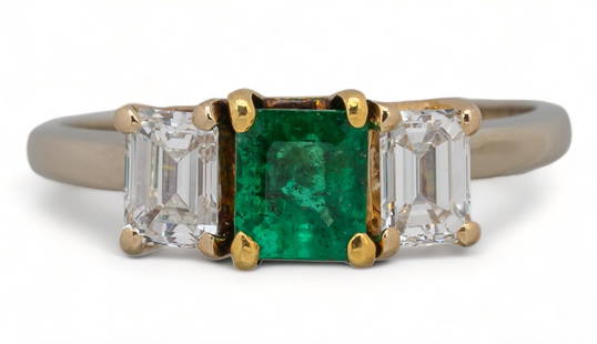 18K Two-Tone Emerald and Diamond Ring: 18K gold two-tone emerald and diamond ring, yellow and white gold, central emerald cut emerald (approx. .59 ct) and two (2) side set baguette cut diamonds (approx. .36 ct/ each), marked stone set